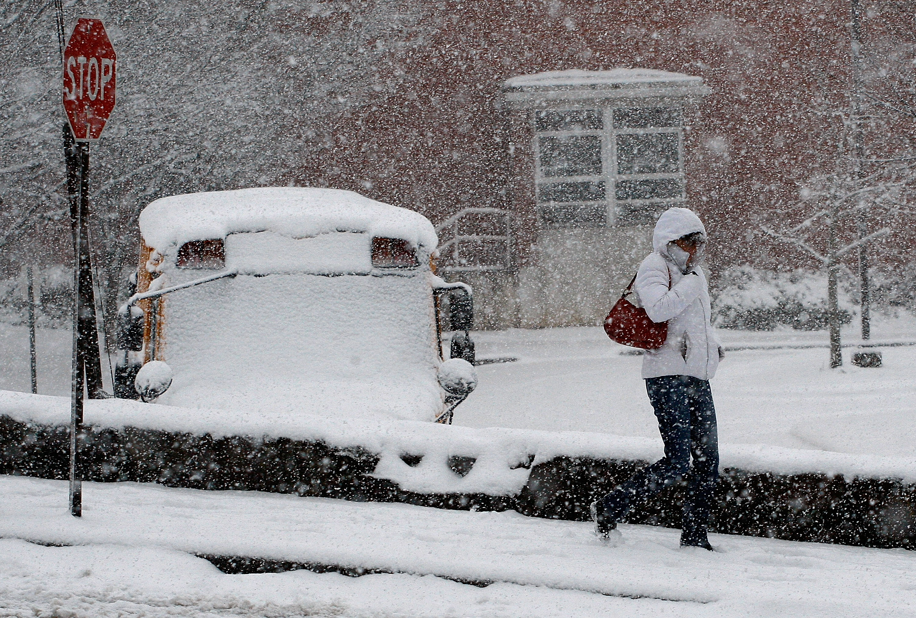 A woman walks in the falling snow in North Carolina | Source: Getty Images