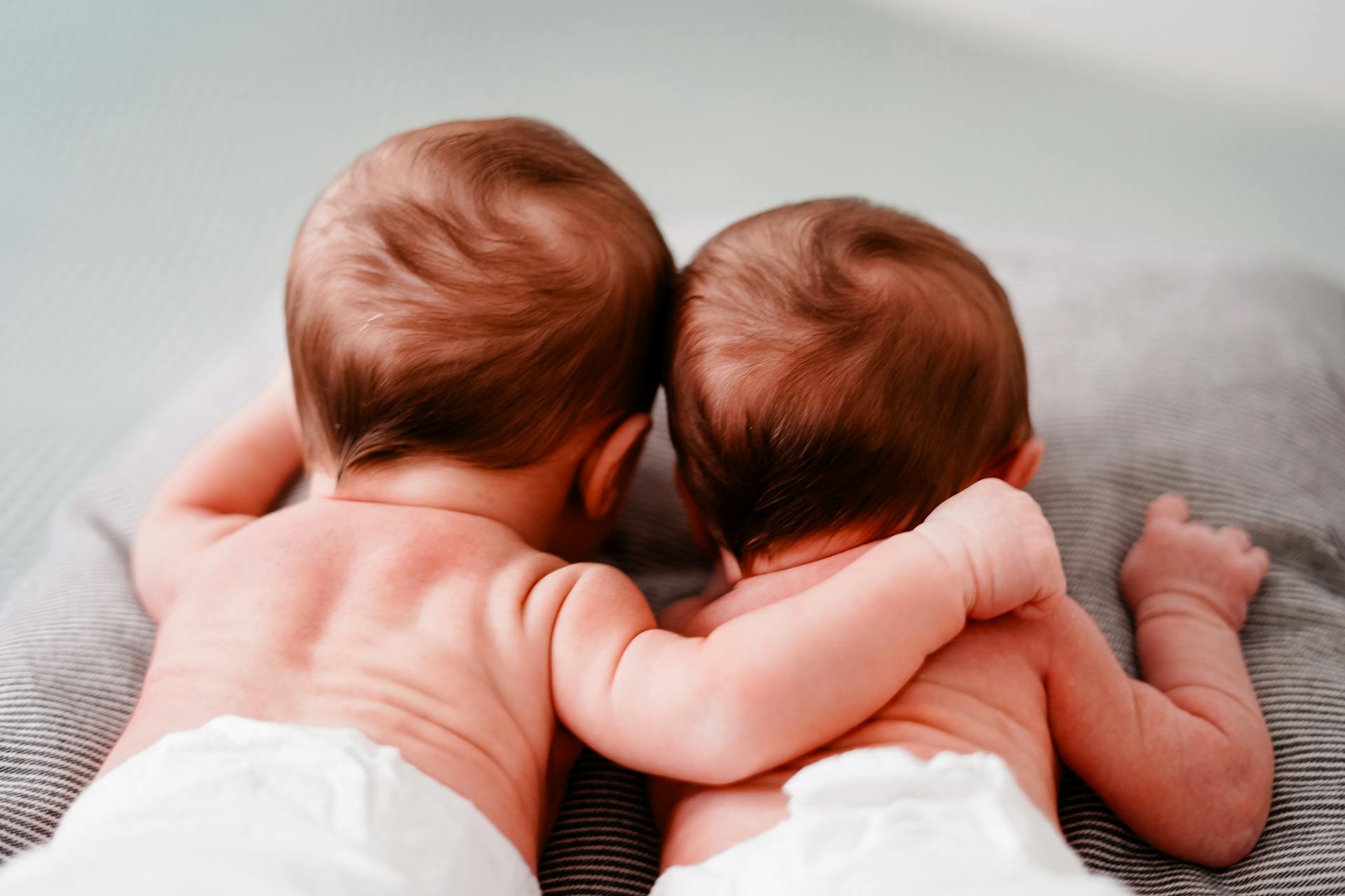 A back view of newborn babies lying next to each other | Source: Pexels