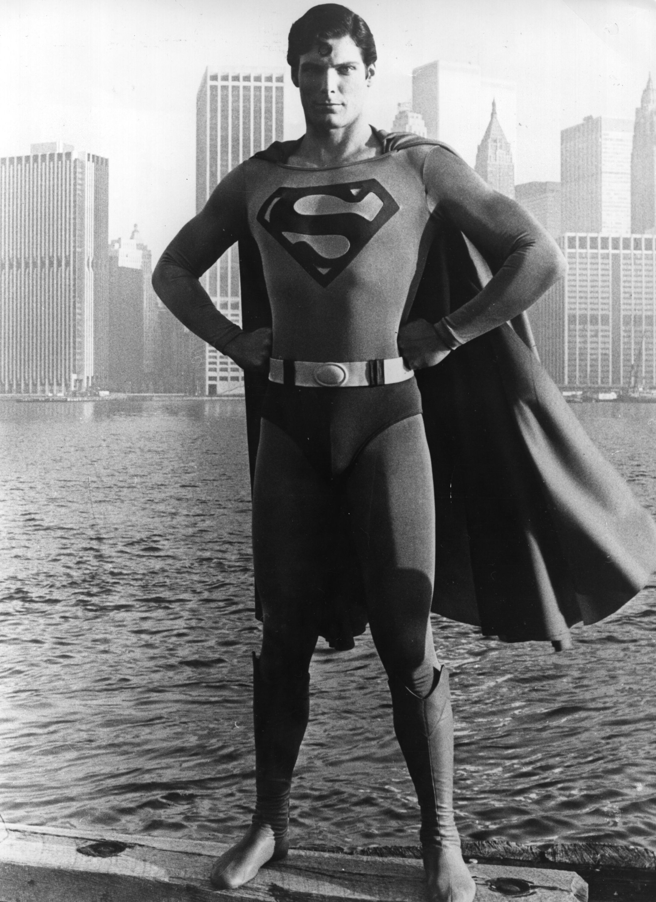 Christopher Reeve pictured standing before the Manhattan skyline dressed as the comic-book hero of the film