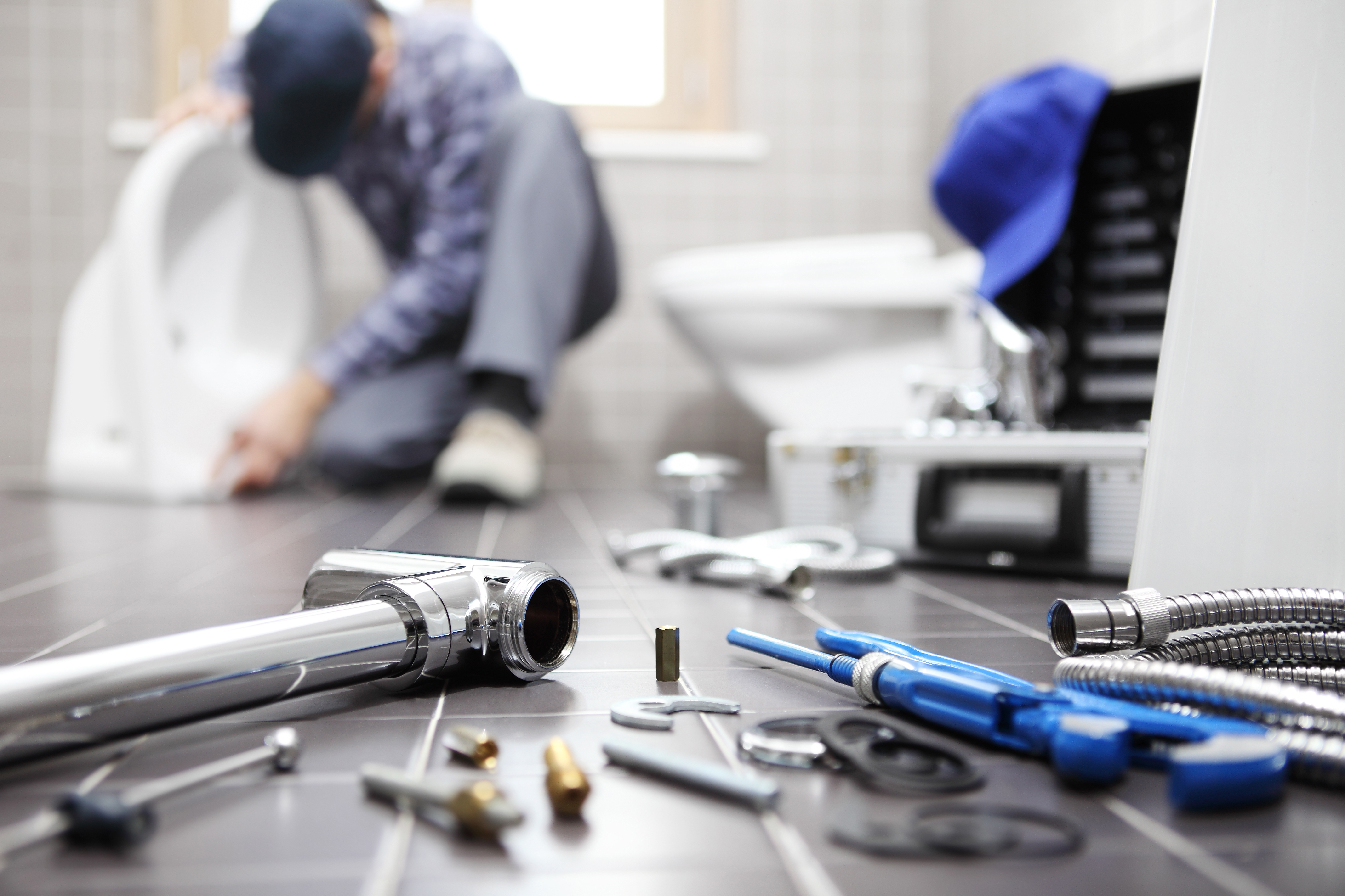 A plumber hard at work | Source: Shutterstock