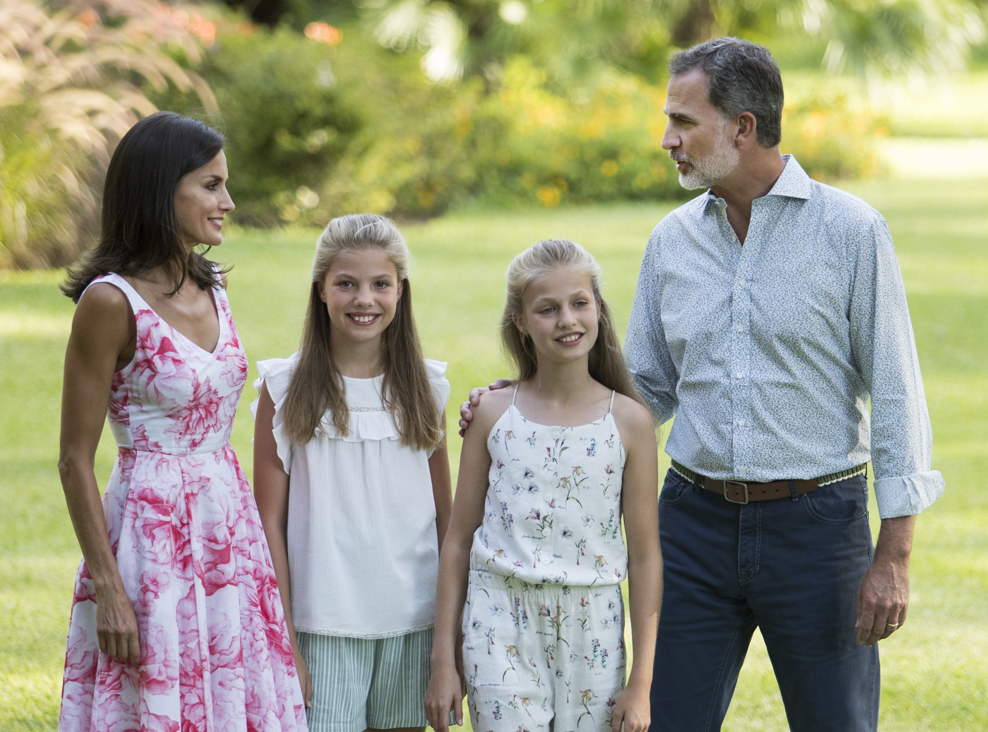 King Felipe VI and Queen Letizia posing with their daughters Spanish Crown Princess Leonor (R) and Princess Sofia in the gardens at the Marivent palace on the island of Majorca on August 4, 2019. / Source: Getty Images