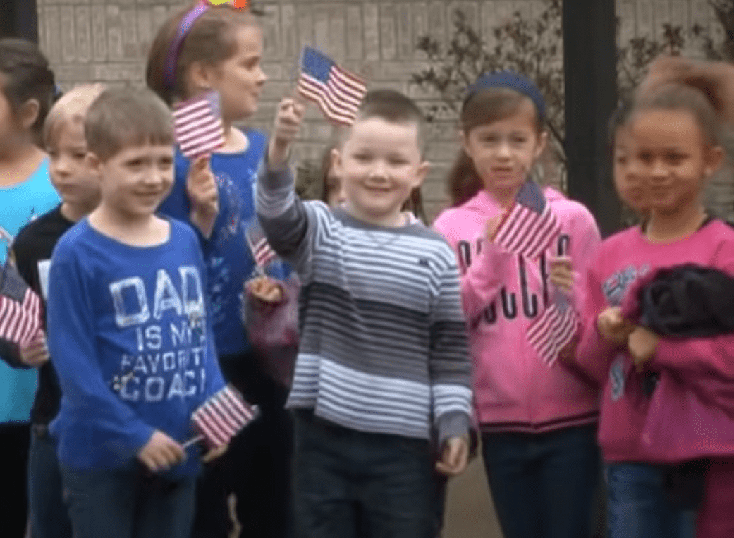 Schoolmates waiting to surprise Ryan and Skylar.  | Source: youtube.com/USA TODAY