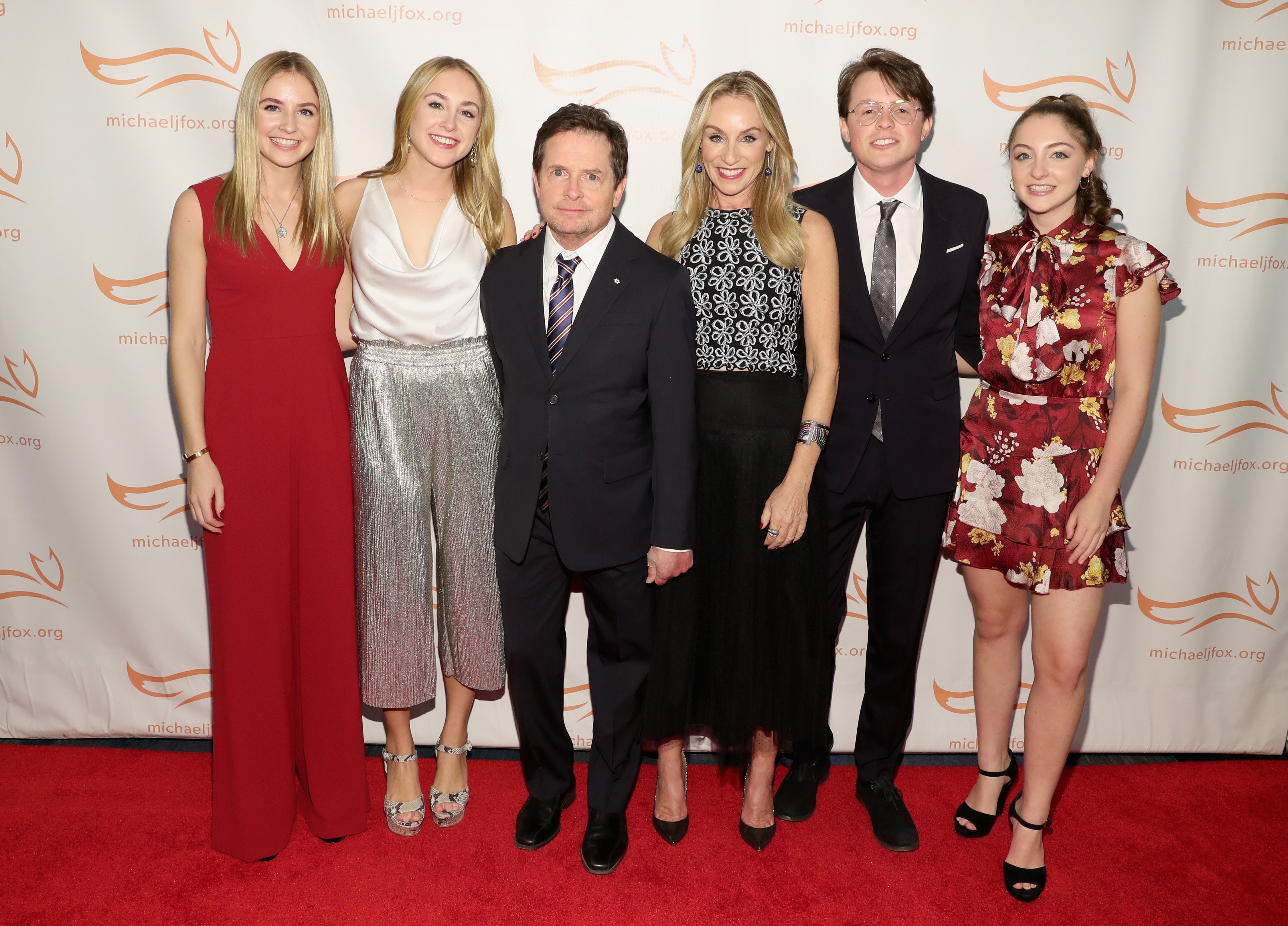 From left to right: Schuyler Fox, Aquinnah Fox, Michael J. Fox, Tracy Pollan, Sam Fox, and Esme Fox on the red carpet of A Funny Thing Happened On The Way To Cure Parkinson's benefitting The Michael J. Fox Foundation at the Hilton on November 10, 2018 in New York. / Source: Getty Images