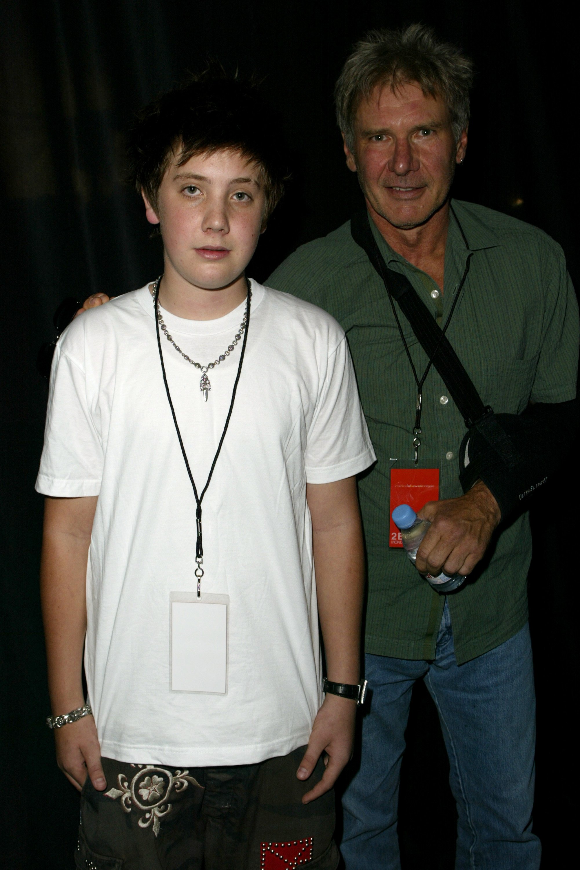 Malcolm and Harrison Ford at the Smashbox Fashion Week in Los Angeles on October 27, 2003. | Source: Jeff Vespa/WireImage/Getty Images
