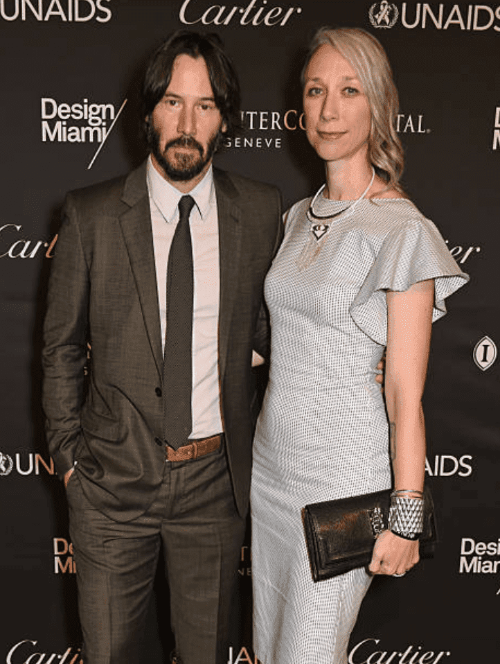 Keanu Reeves and Alexandra Grant pose on the red carpet at the UNAIDS Gala, on June 13, 2016 in Basel, Switzerland | Source: David M. Benett/Dave Benett/Getty Images