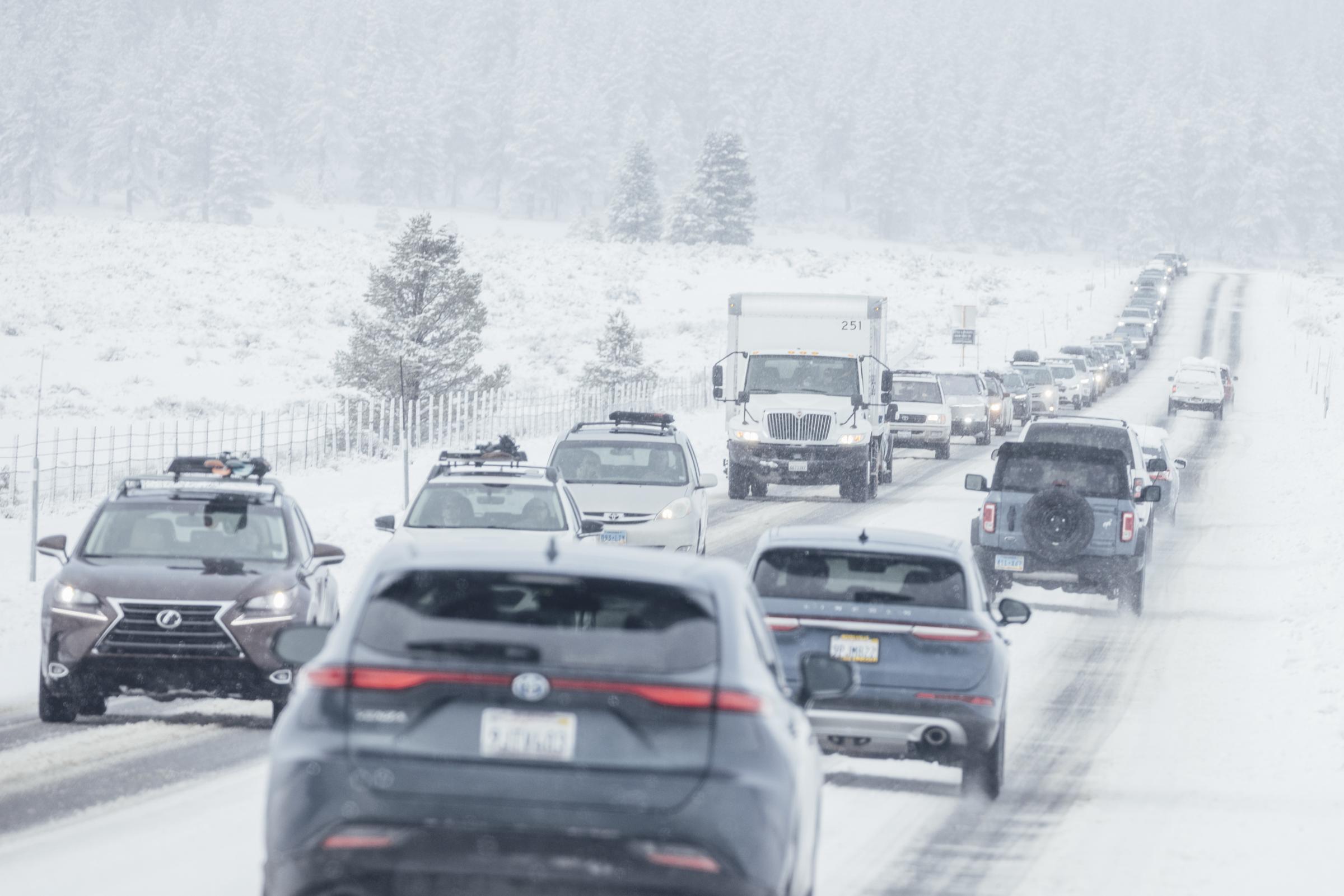 Motorists travel along a snow covered State Route 267 on February 14, 2025, in Truckee, California. | Source: Getty Images