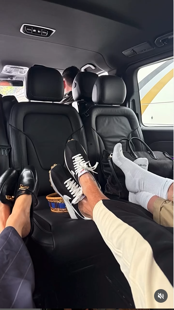 Meghan Markle relaxes with her feet up in the limo beside other passengers, as seen in a post dated October 5, 2025 | Source: Instagram/meghan