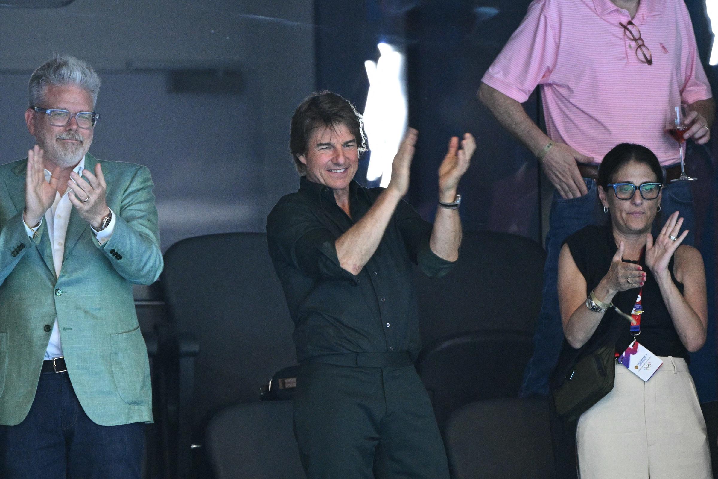 Tom Cruise applauding on day one of the Olympic Games on July 27, 2024 in Paris, France | Source: Getty Images