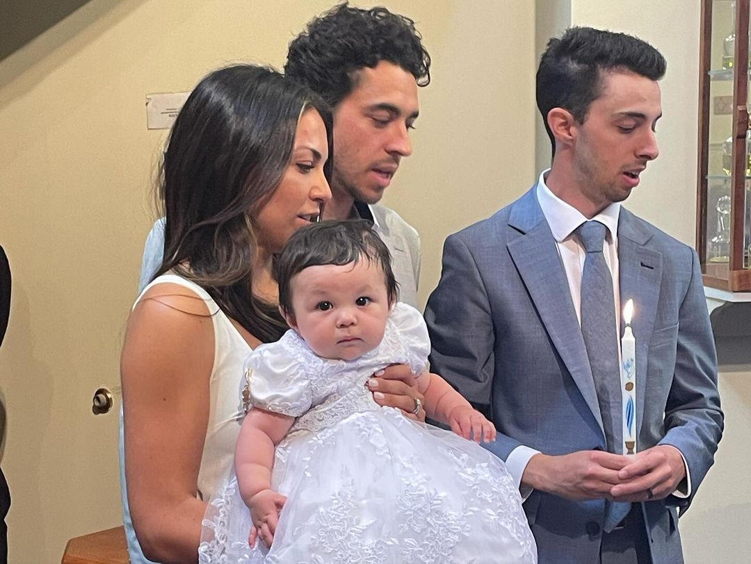 Noa, Meredith, Johnny, and Matty during Noas baptism, from an Instagram slideshow of pictures, dated September 1, 2024 | Source: Instagram/meredithgaudreau_