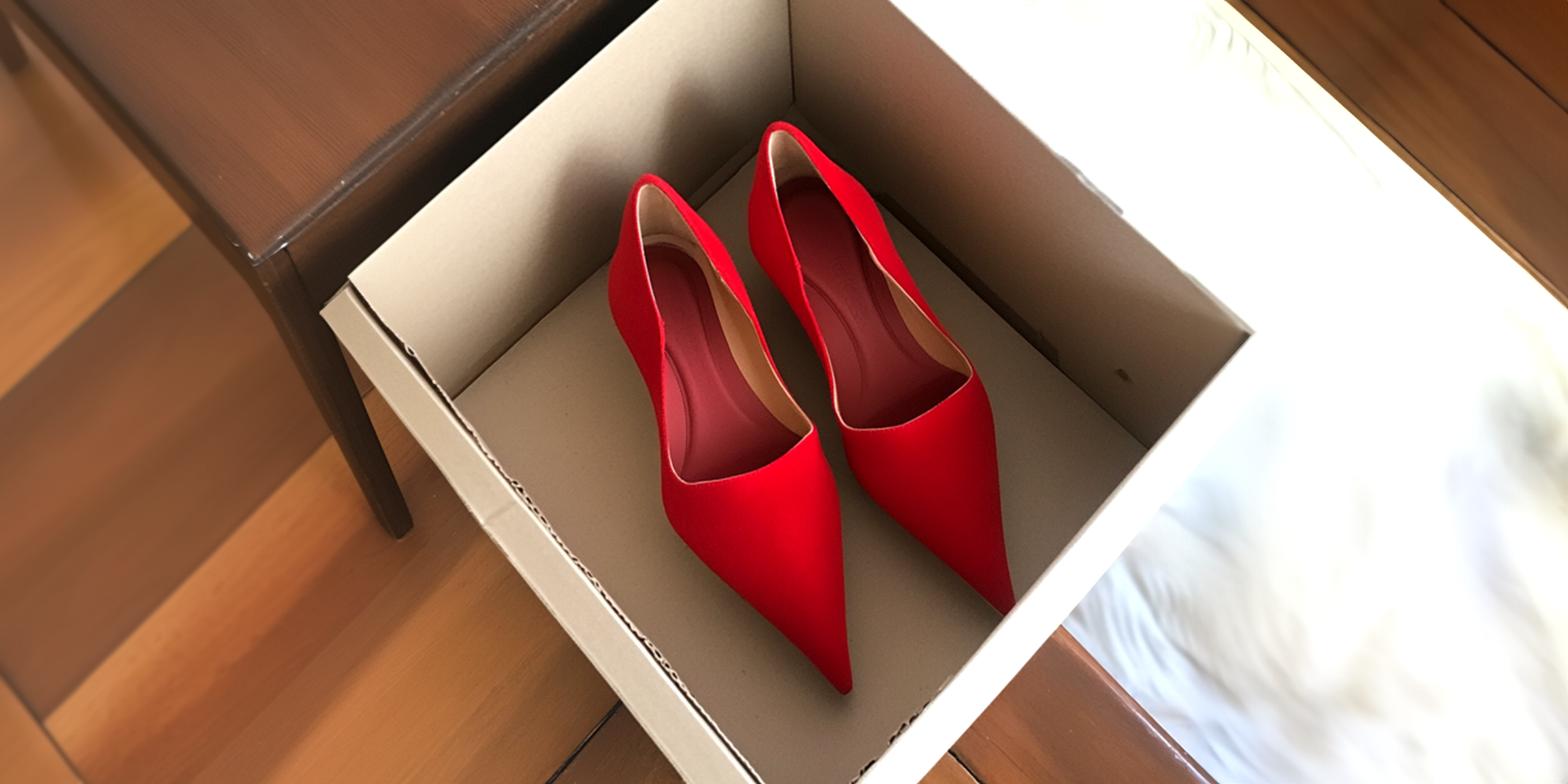 Red heels in a box | Source: 