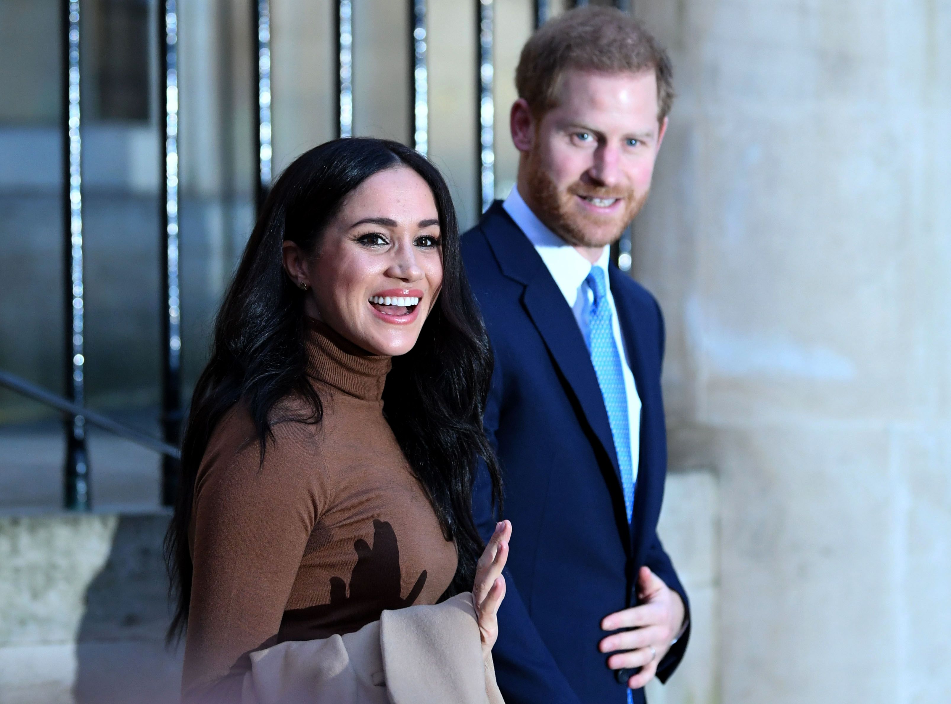 Prince Harry and Meghan Markle react after their visit to Canada House in thanks for the warm Canadian hospitality and support they received during their recent stay in Canada, on January 7, 2020 | Source: Getty Images