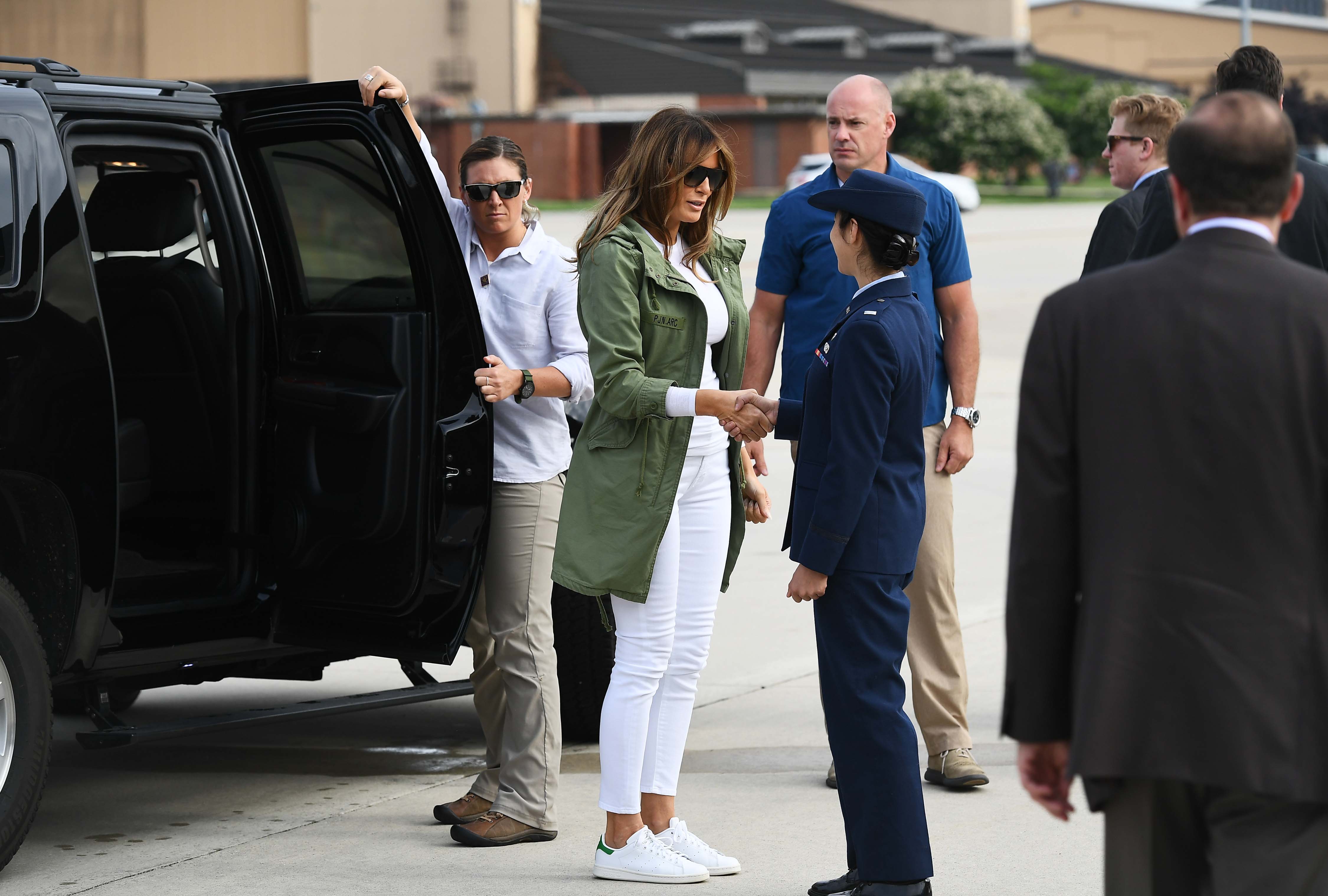 Melania Trump is greeted before boarding a flight at Andrews Air Force Base in Maryland on June 12, 2018 | Source: Getty Images