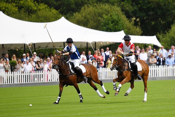 Prince William, Duke of Cambridge and Prince Harry, Duke of Sussex compete at the King Power Royal Charity Polo Day for the Vichai Srivaddhanaprabha Memorial Trophy at Billingbear Polo Club on July 10, 2019, in Wokingham, England. | Source: Getty Images.
