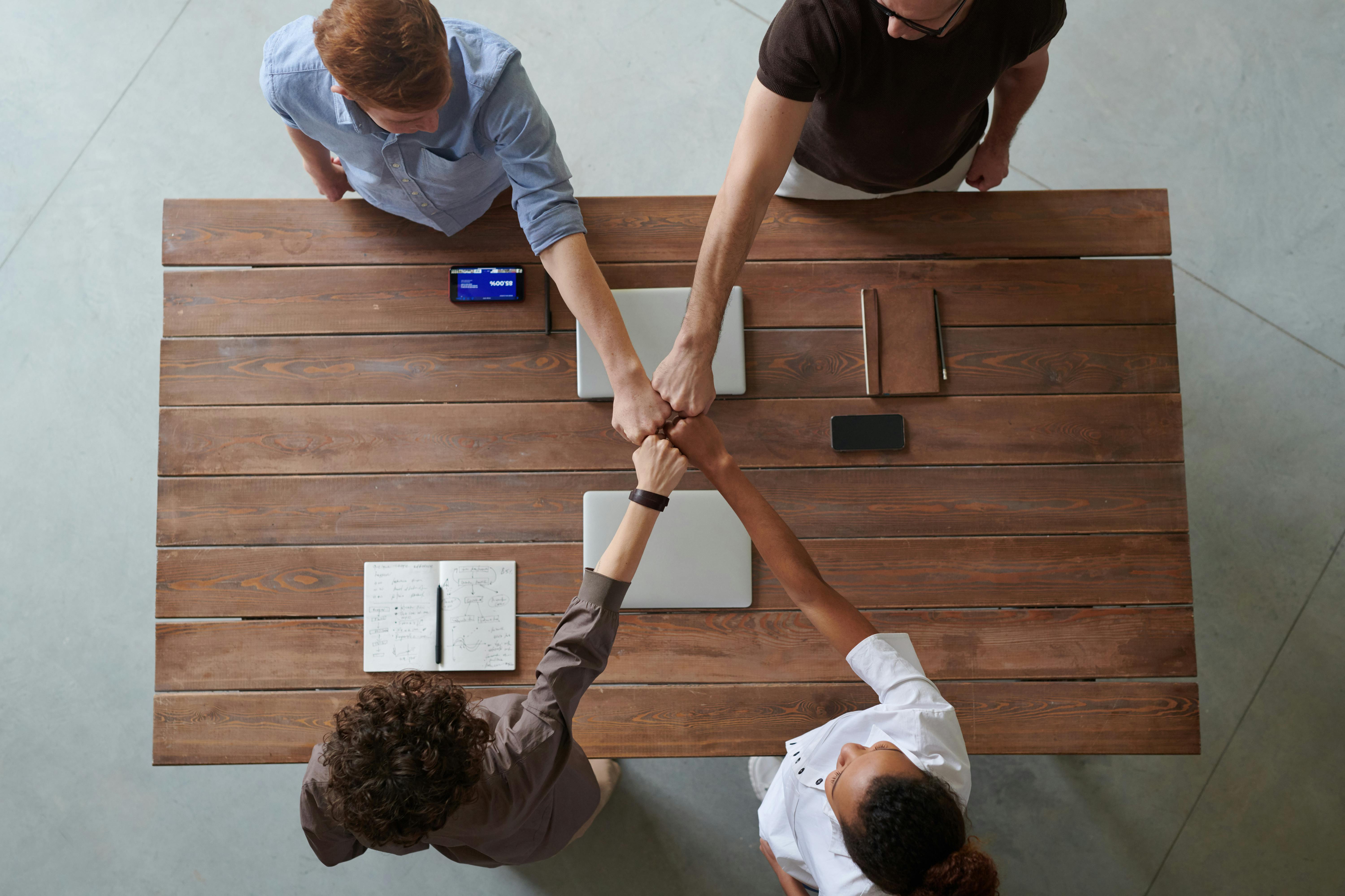 Four friends making a pact | Source: Pexels