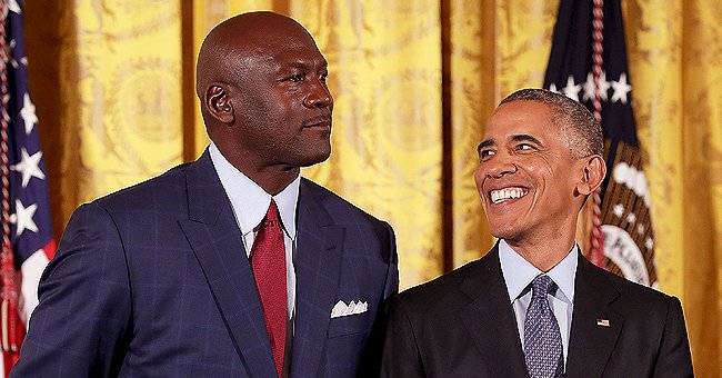 Barack Obama smiles up at National Basketball Association Hall of Fame member and legendary athlete Michael Jordan before awarding him with the Presidential Medal of Freedom during a ceremony in the East Room of the White House November 22, 2016 in Washington, DC. | Photo: Getty Images
