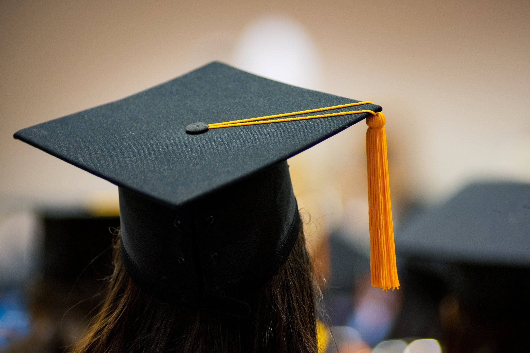 The back of someone wearing a graduation cap. | Photo: Getty Images