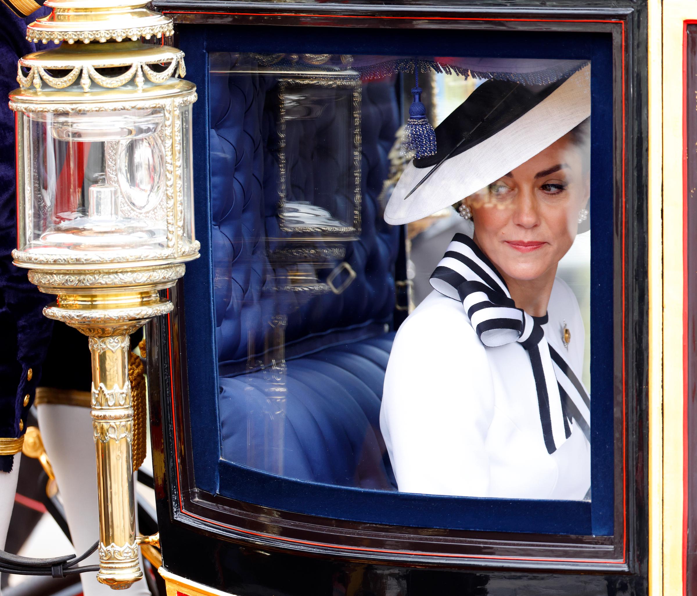 Princess Catherine of Wales looks down as she departs Buckingham Palace in a Glass Coach to attend Trooping the Colour in London on June 15, 2024. | Source: Getty Images