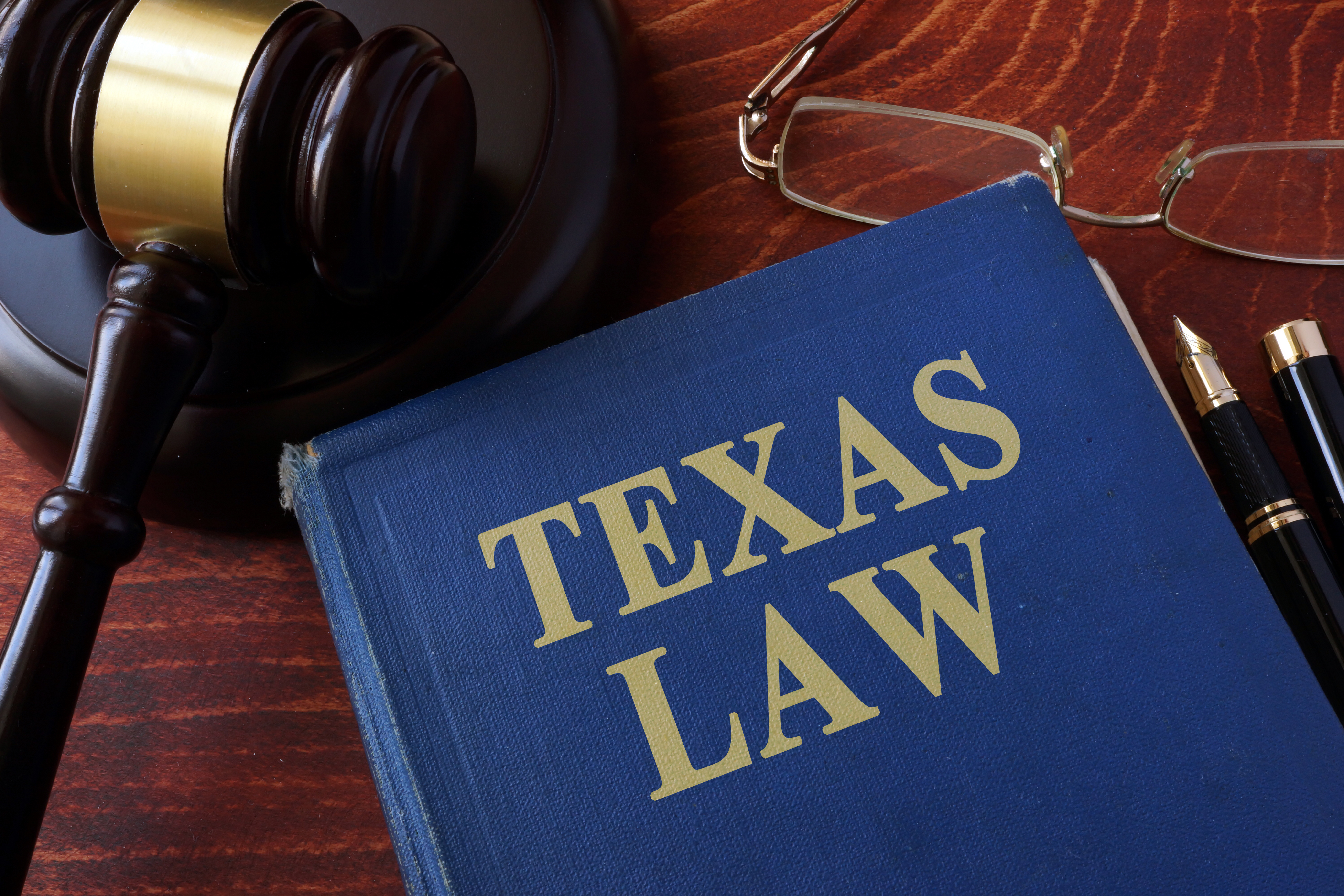 Book with title Texas law and a gavel | Source: Shutterstock