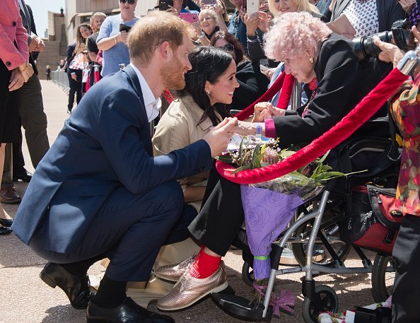  Prince Harry and Meghan with Daphne Dunne at the Sydney Opera House in Sydney, Australia. | Photo: Getty Images.