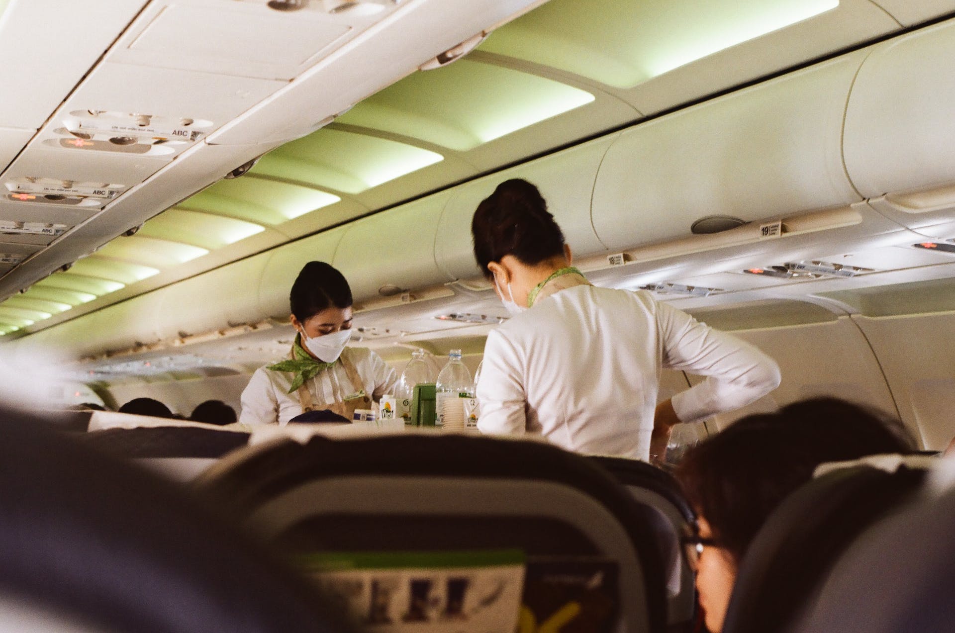 Flight attendants serving food | Source: Pexels