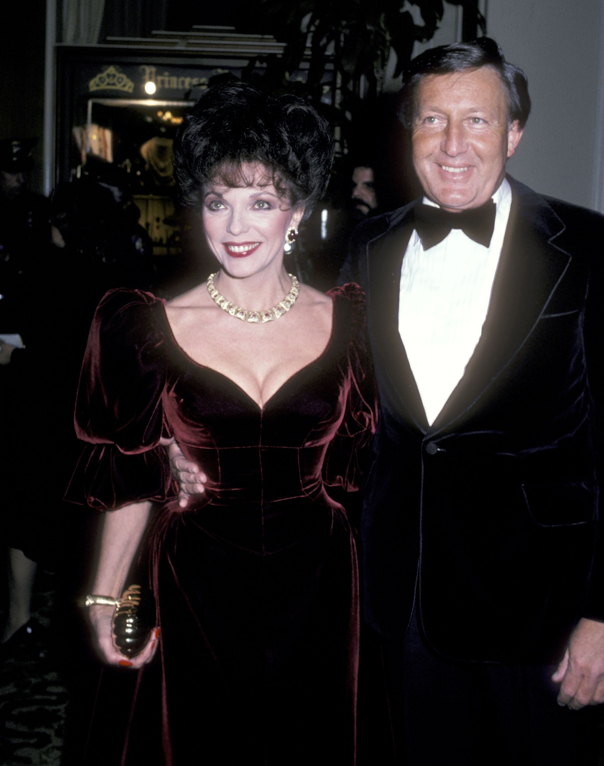 Joan Collins and husband Ronald Kass during the 39th Annual Golden Globe Awards on January 30, 1982 | Source: Getty Images