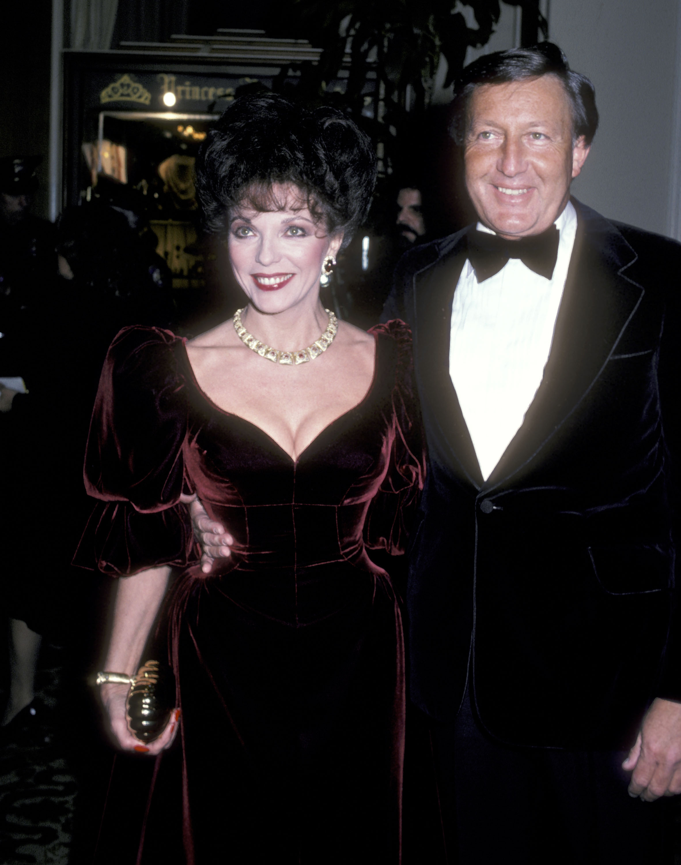 Joan Collins and husband Ronald Kass during the 39th Annual Golden Globe Awards on January 30, 1982  | Source: Getty Images