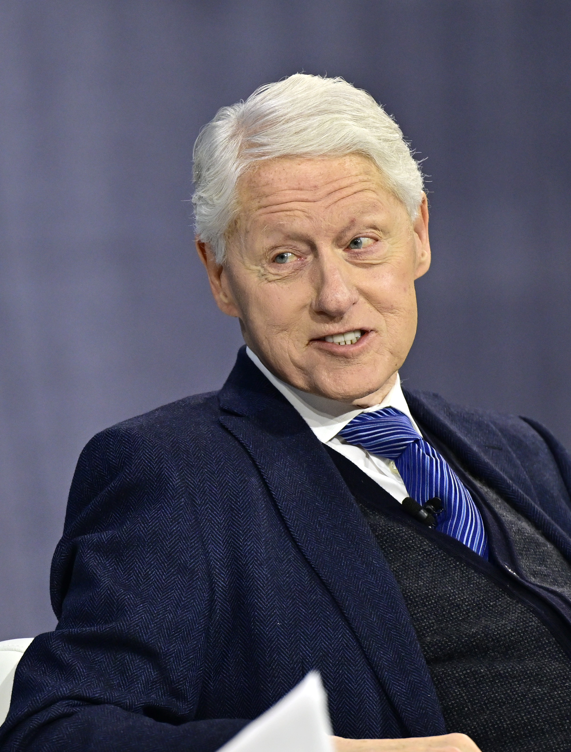 Former U.S. President Bill Clinton speaking during The New York Times Dealbook Summit in New York City on December 4, 2024. | Source: Getty Images