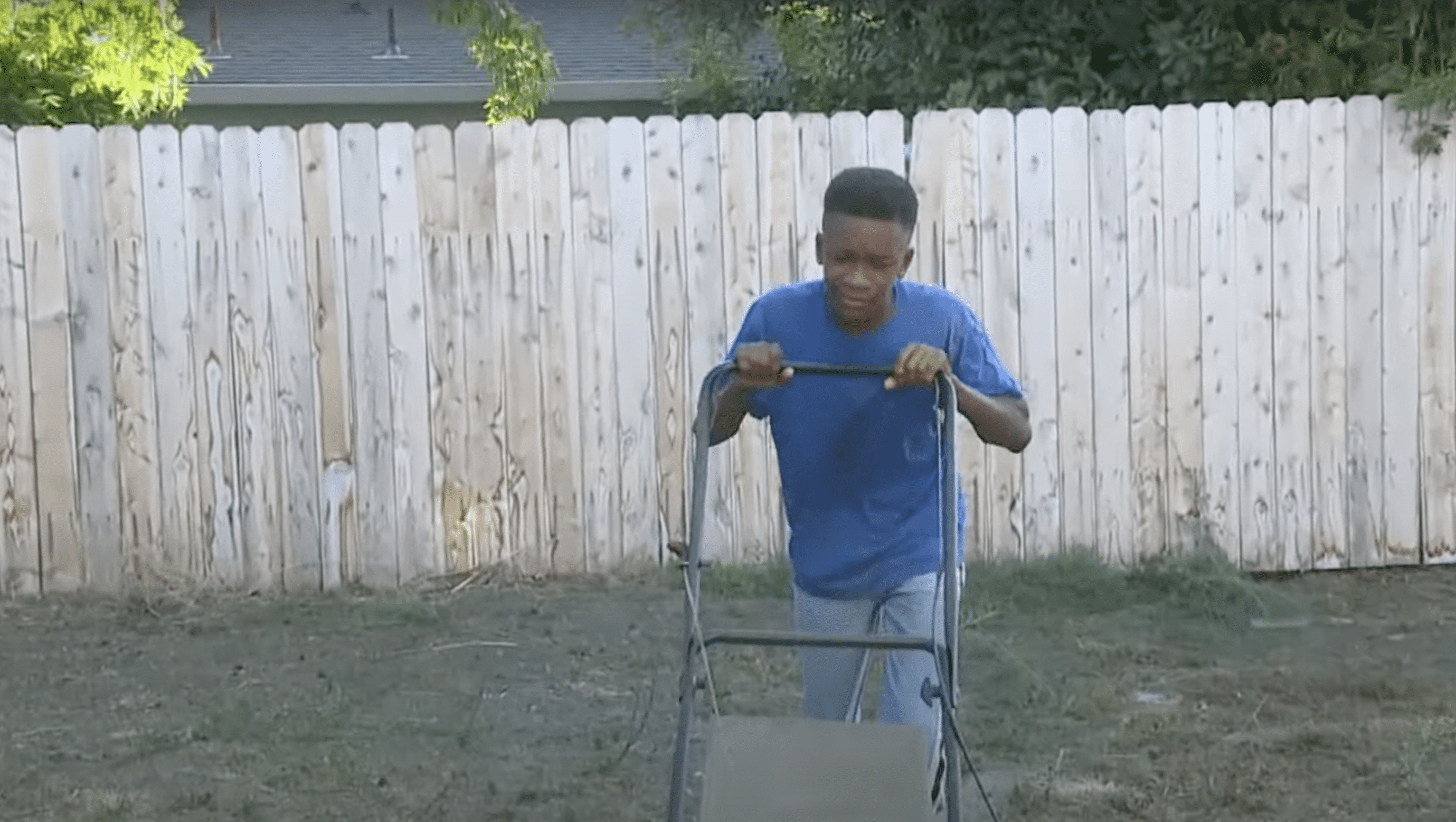 Johnson pictured while handling the lawn mower. | Source: youtube.com/FOX40 News