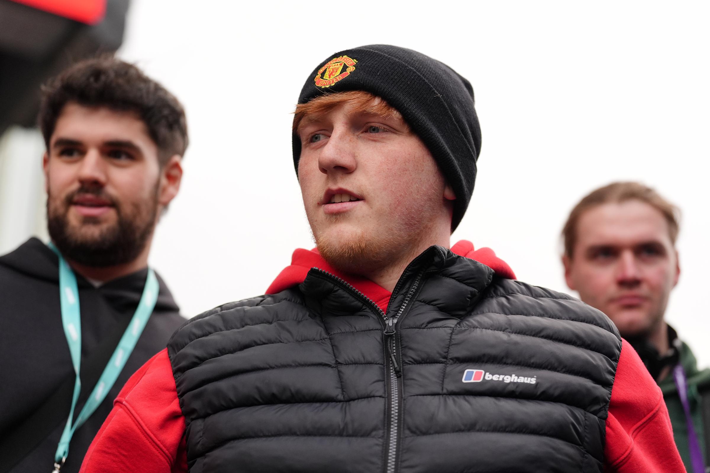 Morgan Burtwistle, known as Angry Ginge, was seen wearing a black Berghaus puffer jacket and a Manchester United beanie as he appeared ahead of the Premier League clash at Selhurst Park on May 6, 2024. With his trademark red hair and youthful face, the 24-year-old would later undergo a dramatic transformation in the jungle, losing seven kilograms during his time on "I'm a Celebrity...Get Me Out of Here!"