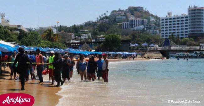 Body riddled with bullet holes washes up on a Mexican beach as tourists look on