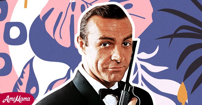 Portrait of Sean Connery, starring as James Bond, with a gun against the side of his face. | Photo: Getty Images