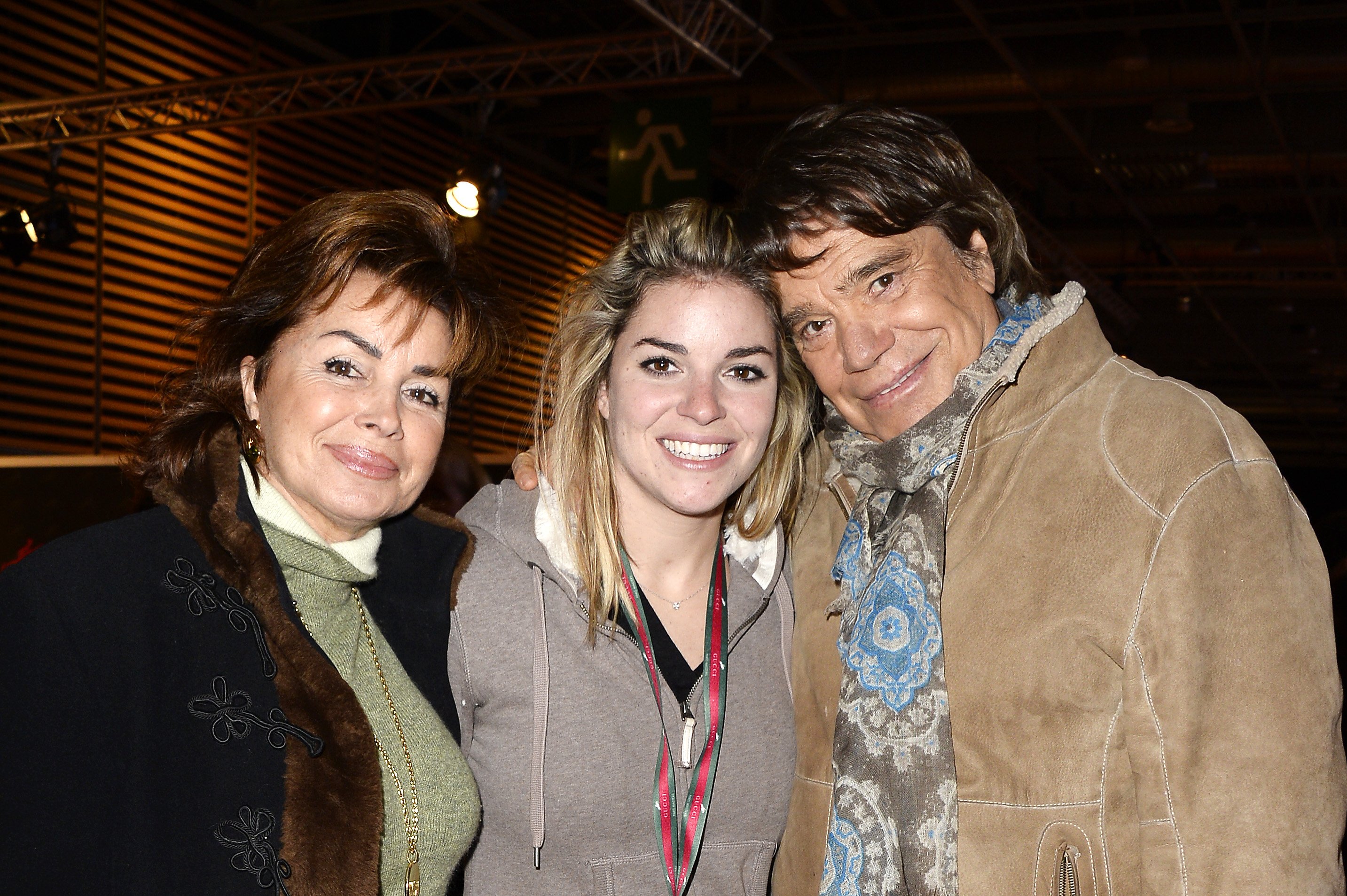 Dominique Tapie, Sophie Tapie et Bernard Tapie participent au Gucci Paris Masters 2013 le 7 décembre 2013 à Paris, France. | Photo : Getty Images