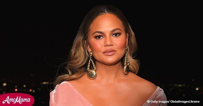 Pregnant Chrissy Teigen flashes gorgeous cleavage in pale pink sleeveless gown at recent outing