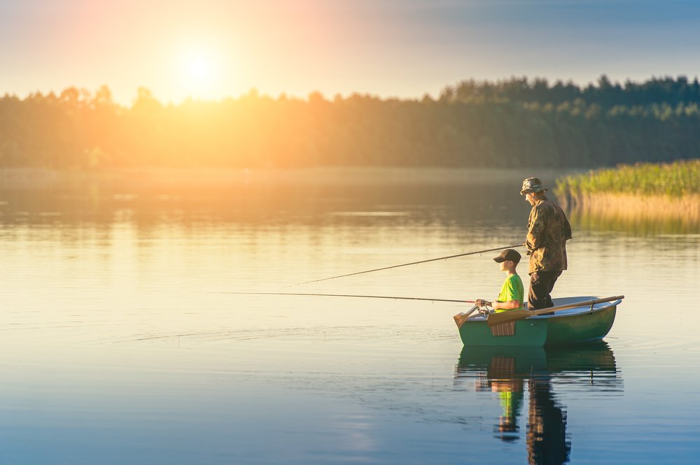 A man and a boy on a fishing boat | Photo: Shutterstock