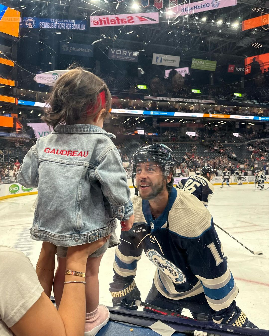 Johnny and Noa Gaudreau  talking before a game, from an Instagram slideshow of pictures, dated September 1, 2024 | Source: Instagram/meredithgaudreau_