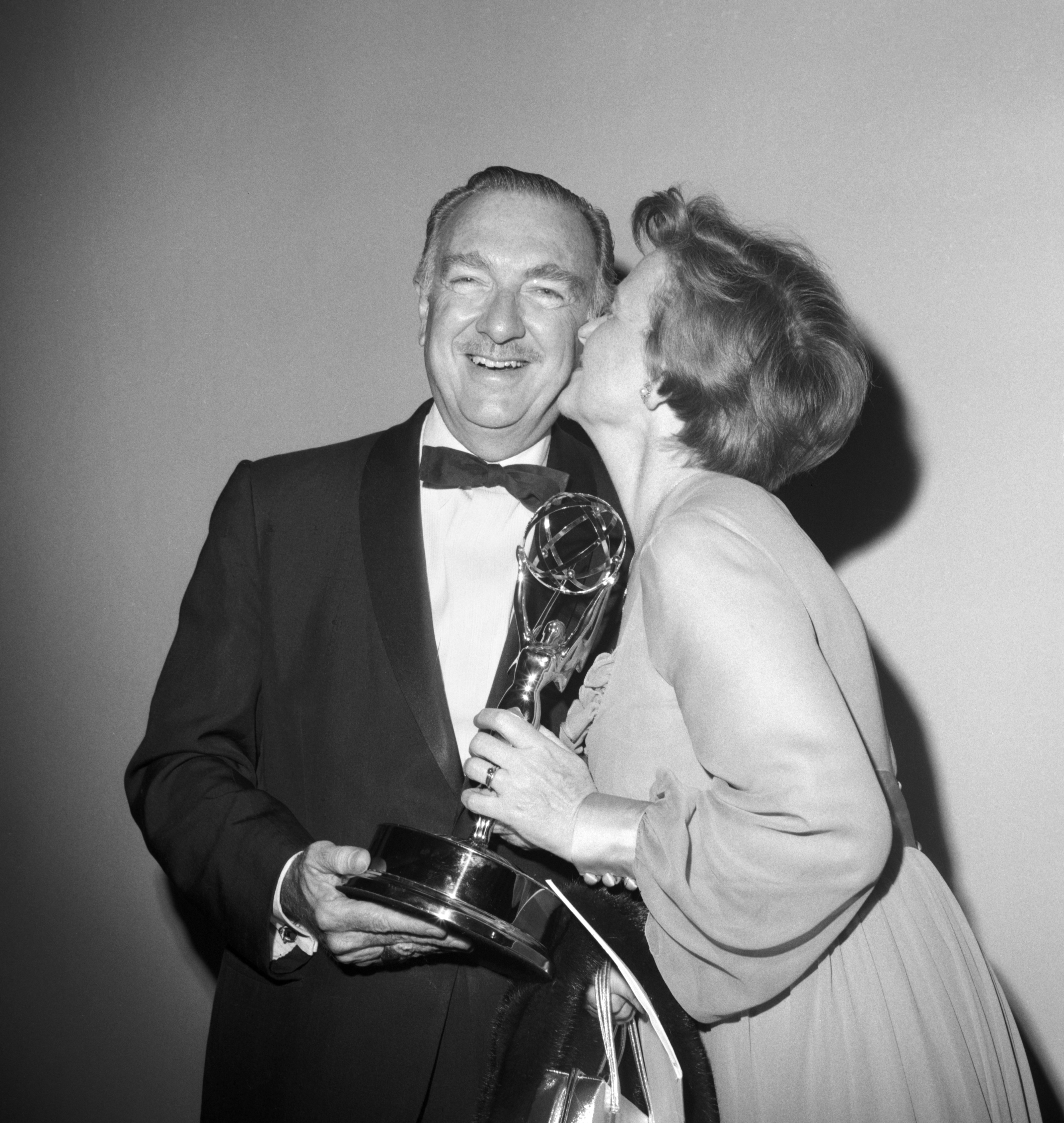 The 22nd Annual EMMY Awards, broadcast from Carnegie Hall, New York, NY. Image dated June 7, 1970. Walter Cronkite, Emmy winner for his CBS News commentary, Man on the Moon: The Epic Journey of Apollo XI, and his wife, Betsy. | Source: Getty Images