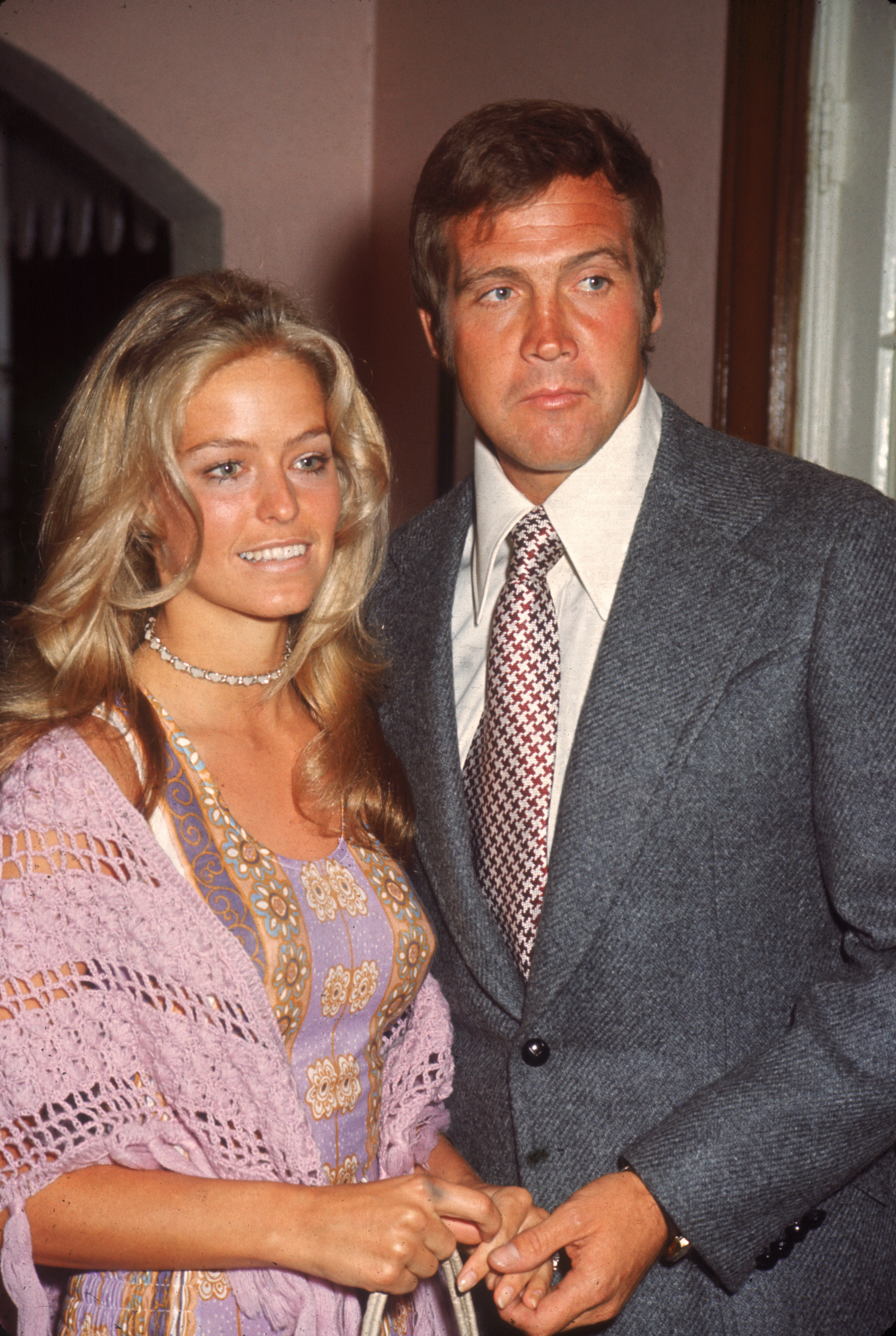 Farrah Fawcett (then known as Farrah Fawcett-Majors) (left) and Lee Majors pose together as they attend a party for ABC-TV screen celebrities in June 1971 | Source: Getty Images