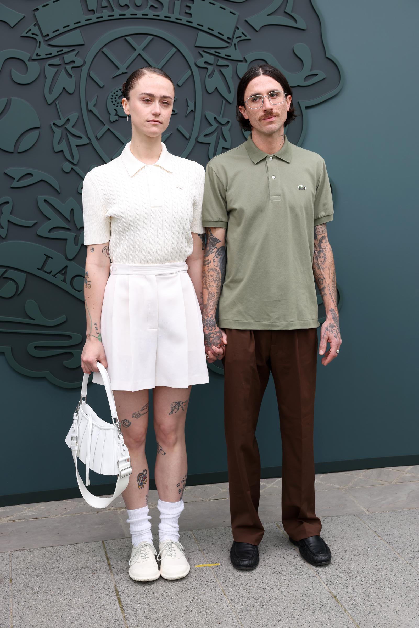 Ella Emhoff holding hands with a guest at the show. | Source: Getty Images