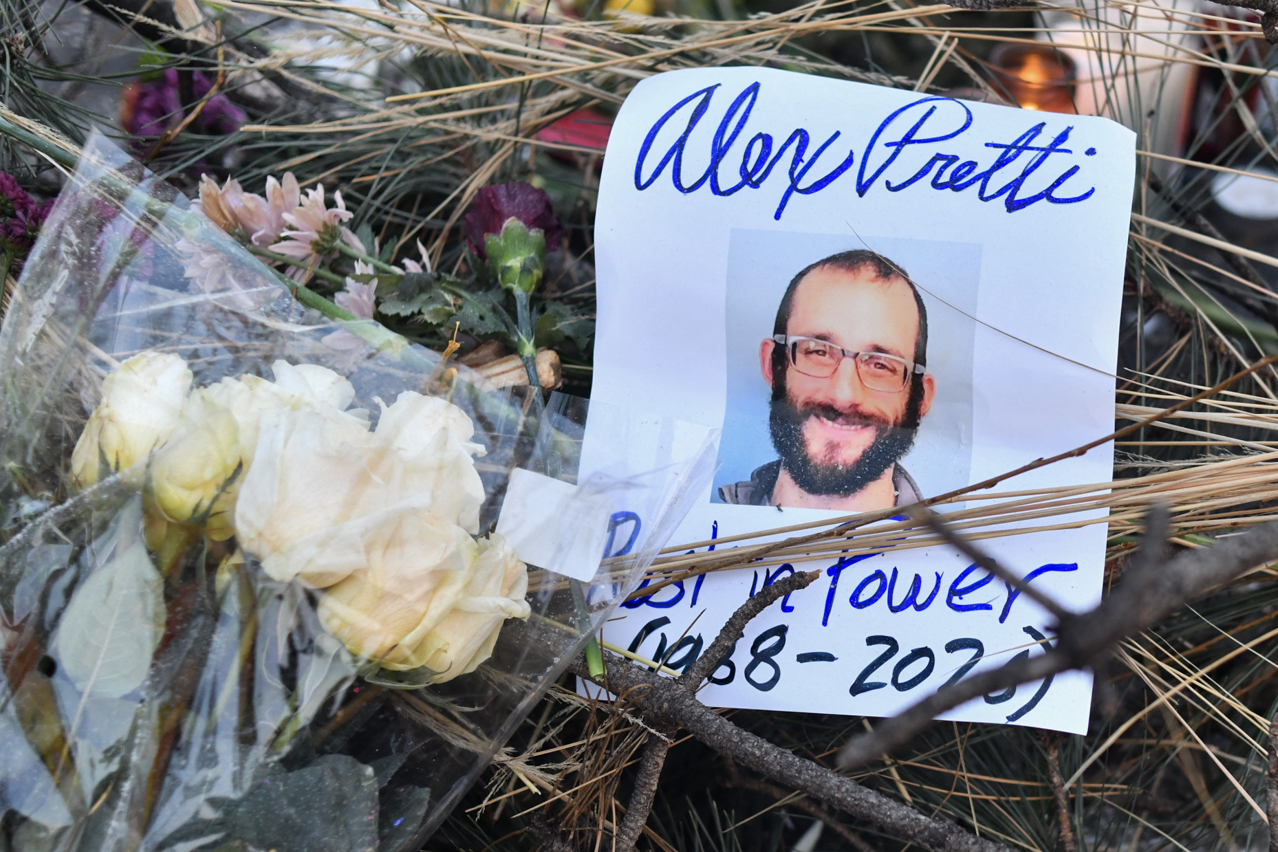 Flowers are left at a makeshift memorial in the area where Alex Pretti was shot dead in Minneapolis, Minnesota, on January 25, 2026. | Source: Getty Images