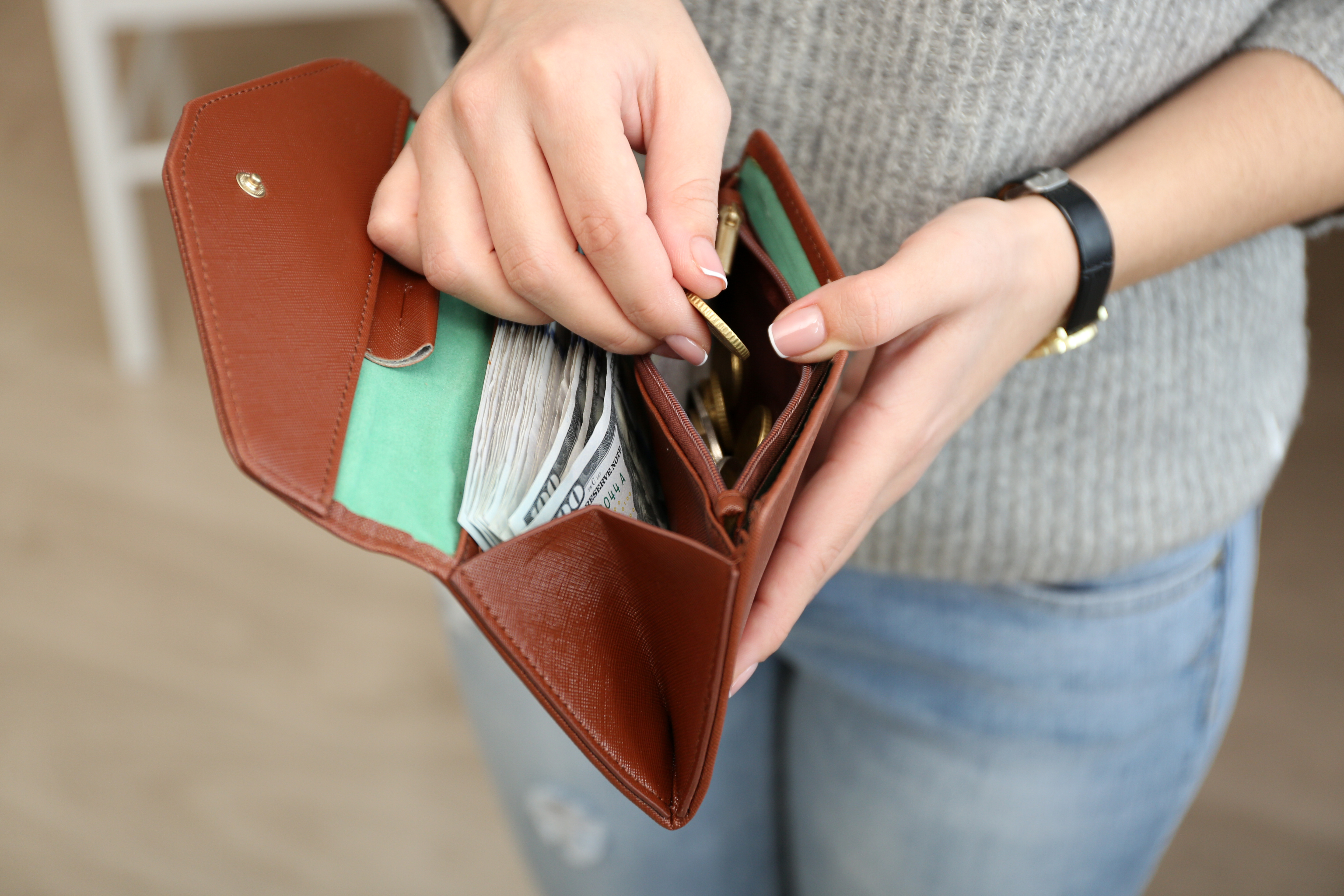 Lost wallet holding by woman | Shutterstock
