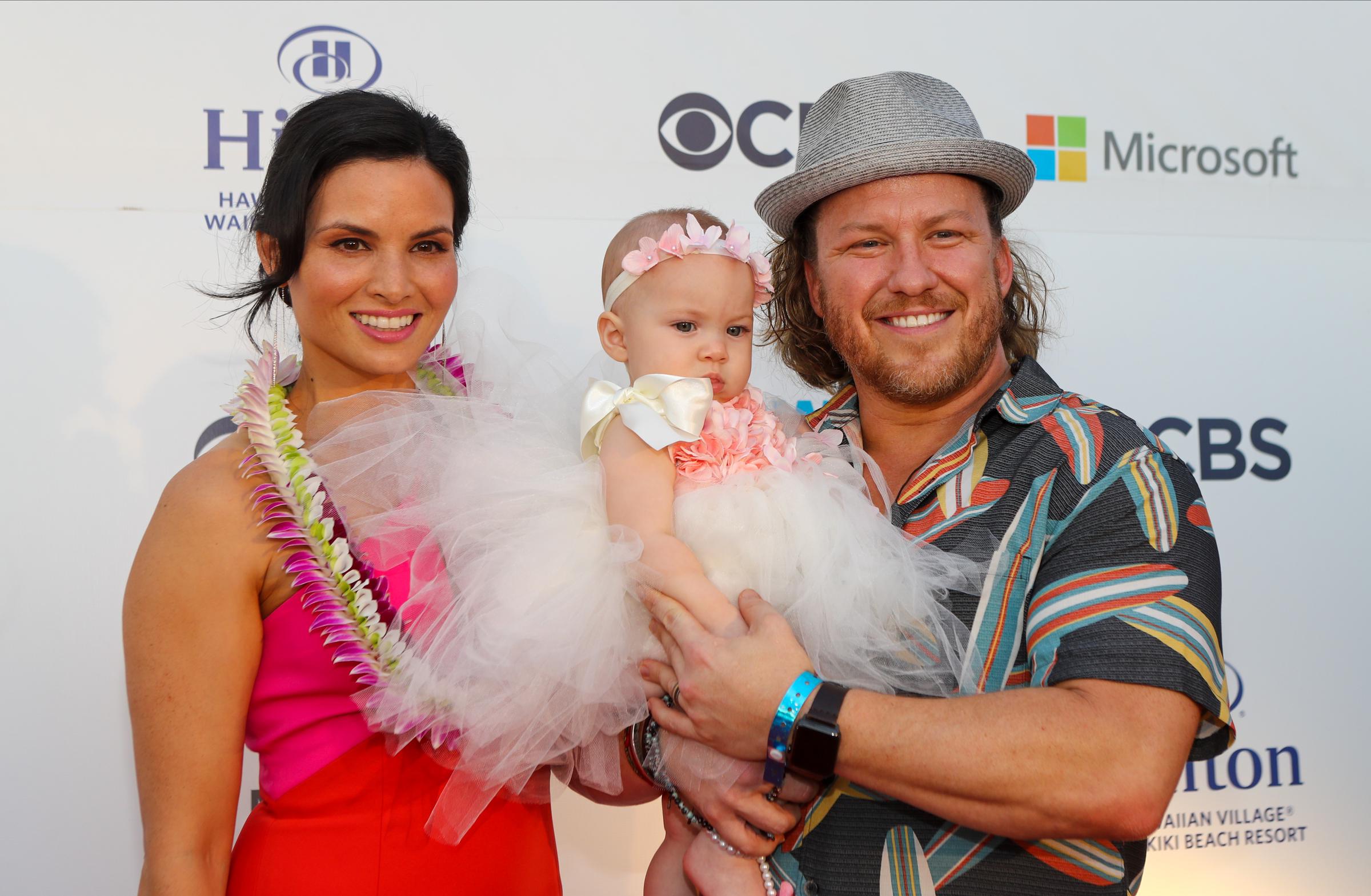 Katrina Law and Keith Andreen with their daughter at the Sunset on the Beach event celebrating the 10th season of "Hawaii Five-0" and season two of "Magnum P.I." on September 19, 2019, in Waikiki, Hawaii. | Source: Getty Images
