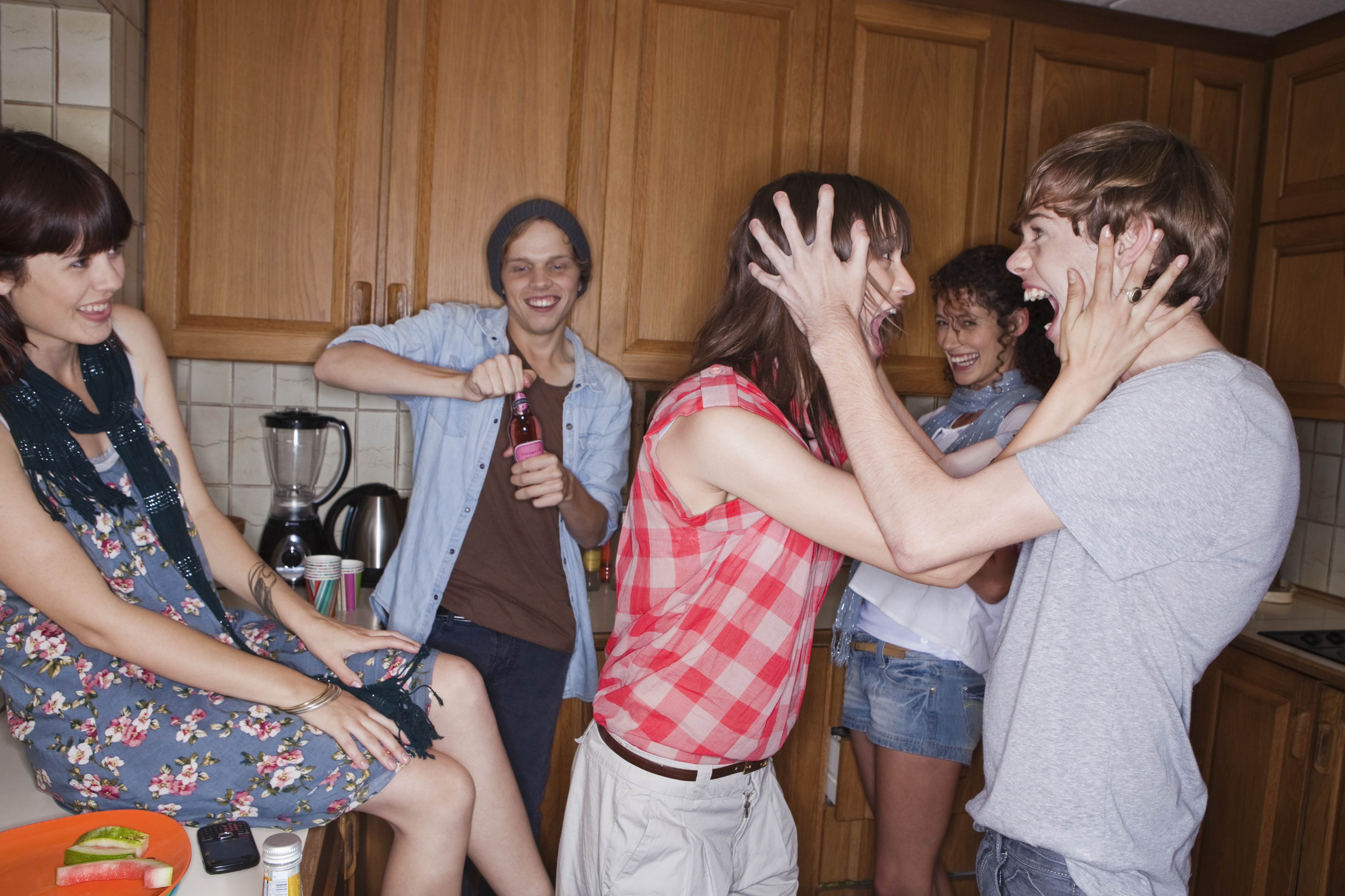 Teens shouting in kitchen | Source: Getty Images