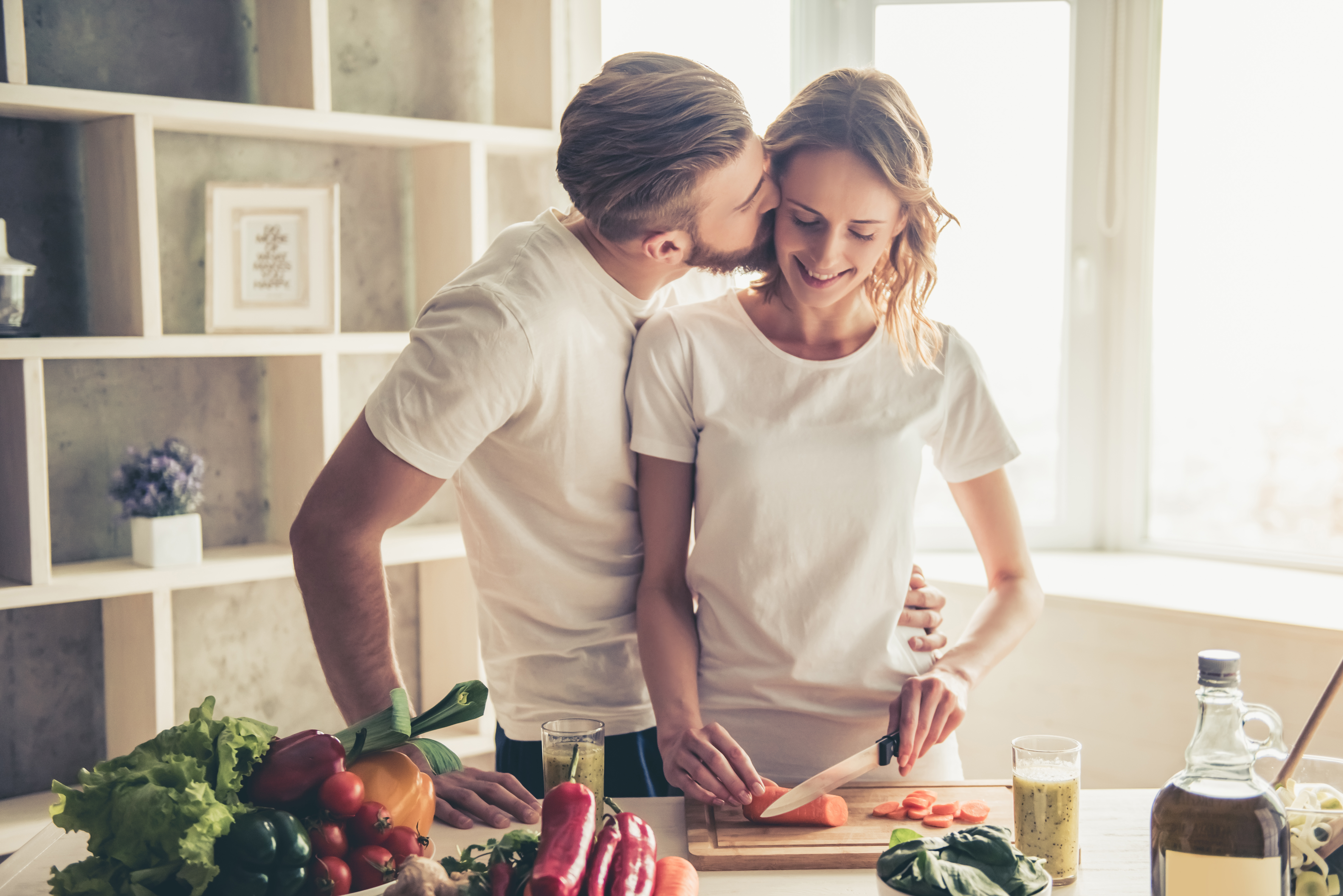 A couple cooking together | Source: Shutterstock