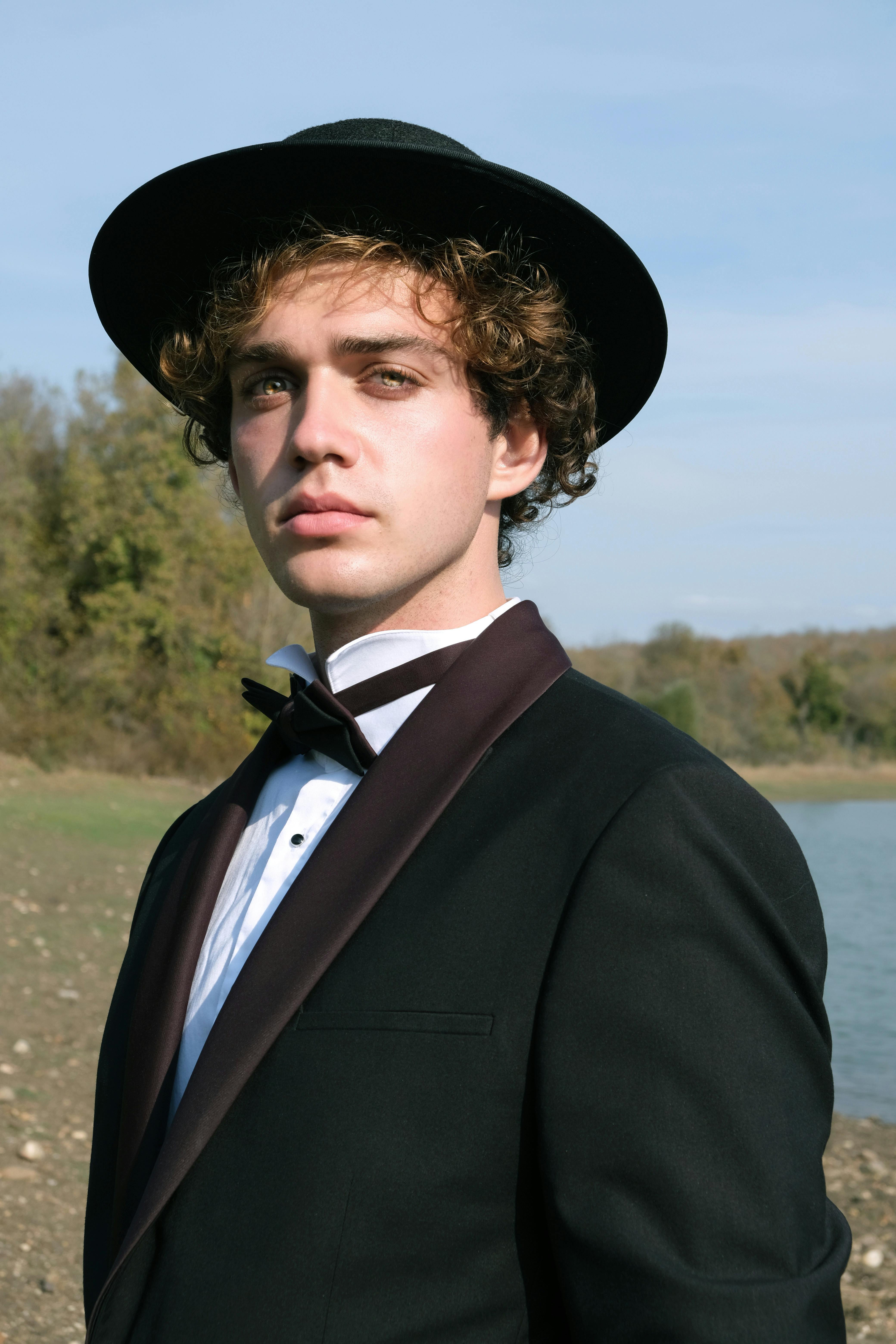 A serious teenage boy looking dapper in a suit | Source: Pexels