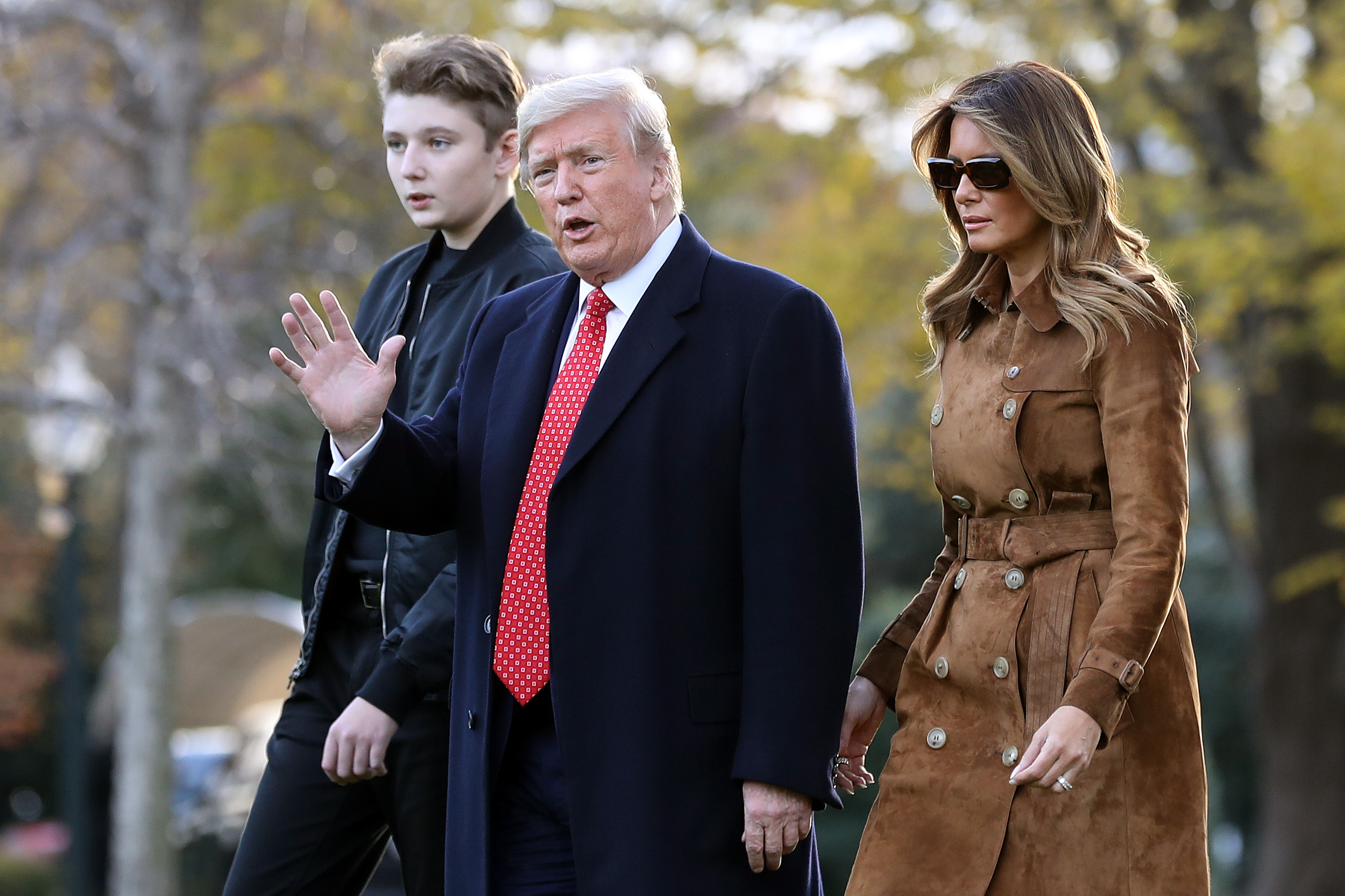 Barron, Donald, and Melania Trump photographed walking across the South Lawn before leaving the White House on board Marine One November 26, 2019, in Washington, D.C. | Source: Getty Images