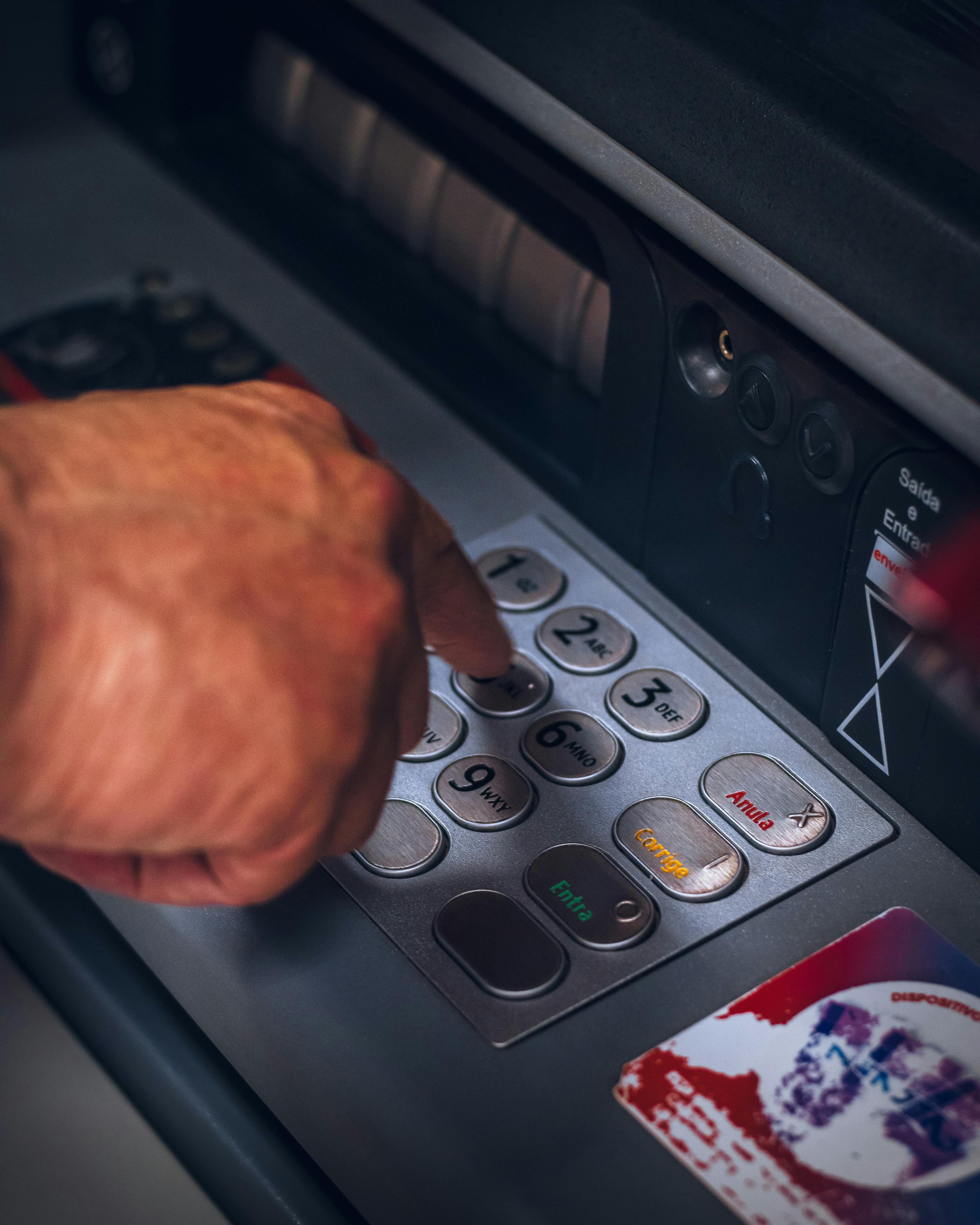 A person withdrawing from an ATM | Source: Pexels