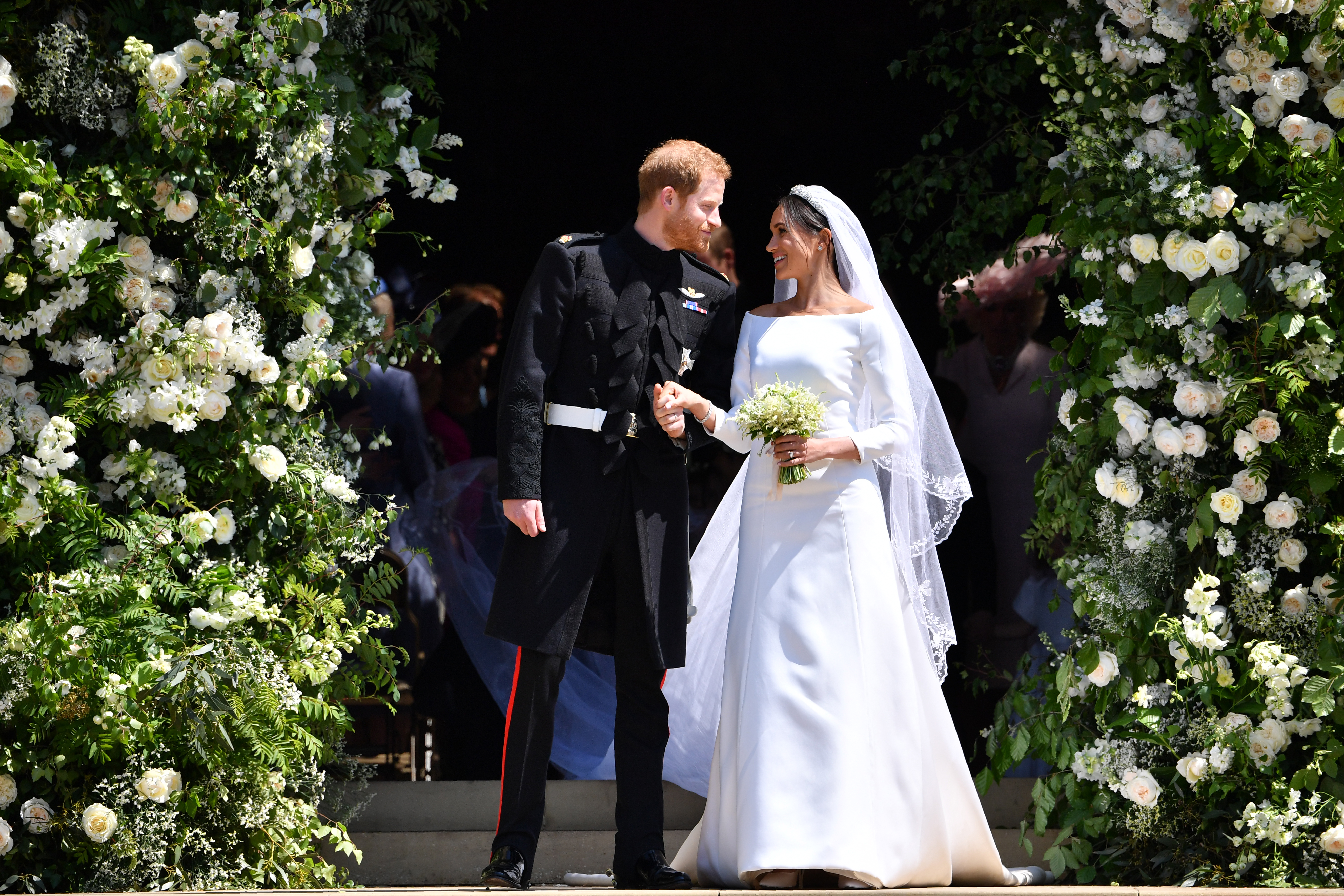 Prince Harry, Duke of Sussex and Meghan, Duchess of Sussex outside the St George's Chapel, Windsor Castle, in Windsor, England, on May 19, 2018. | Source: Getty Images