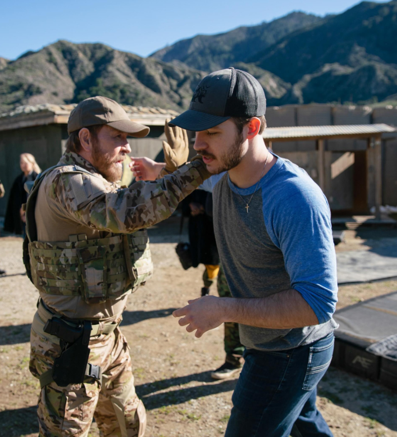 Chuck Norris and Dakota Norris rehearse a fight sequence outdoors, moving in sync against a rugged backdrop. | Source: Instagram/agentthemovie