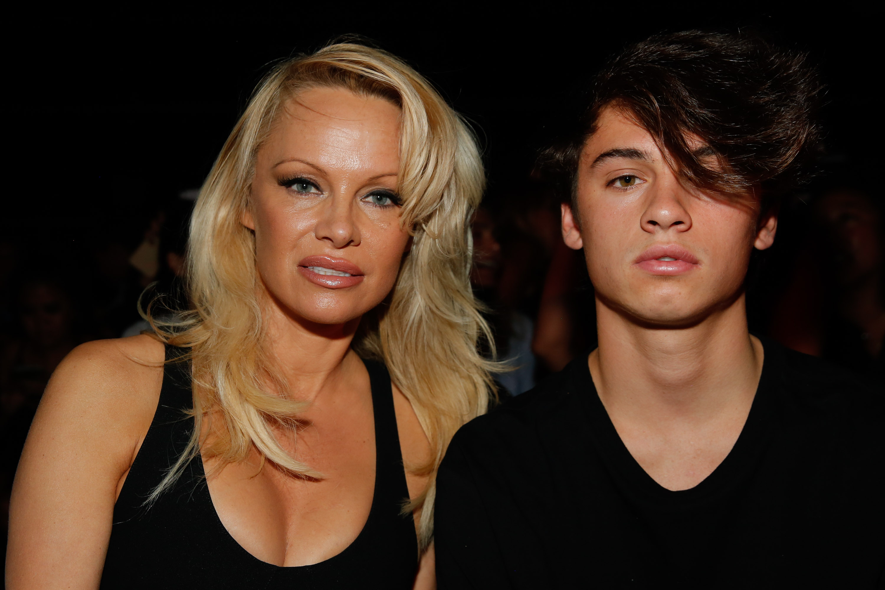 Pamela Anderson and Dylan Lee at the Alexander Wang Spring 2017 fashion show during New York Fashion Week at Pier 94 in New York City on September 10, 2016 | Source: Getty Images