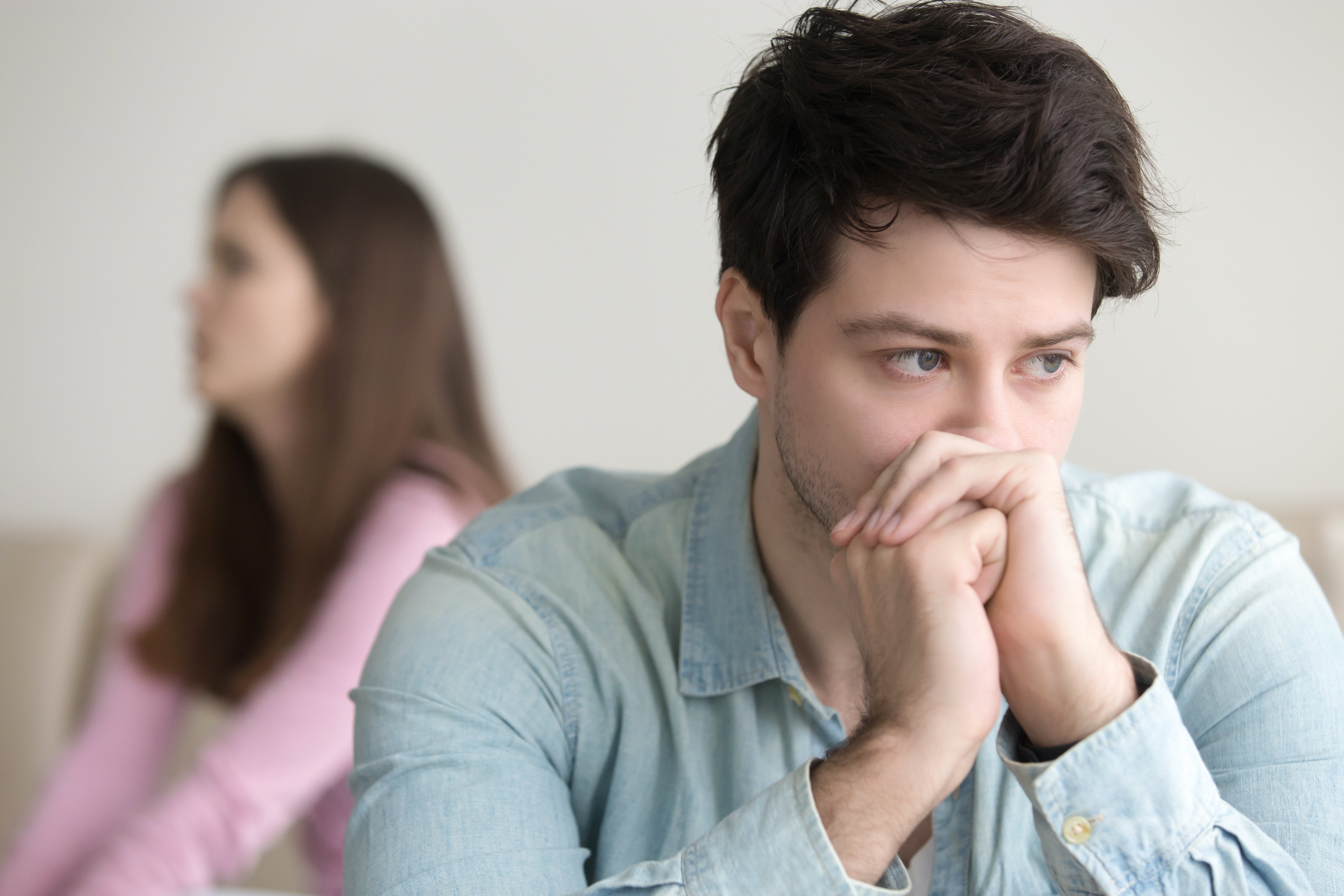 Sad young man thinking over a problem. | Source: Shutterstock